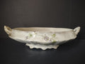 Front view of Homer Laughlin White Granite oval footed bowl with columbine floral decoration and gold gilt accents