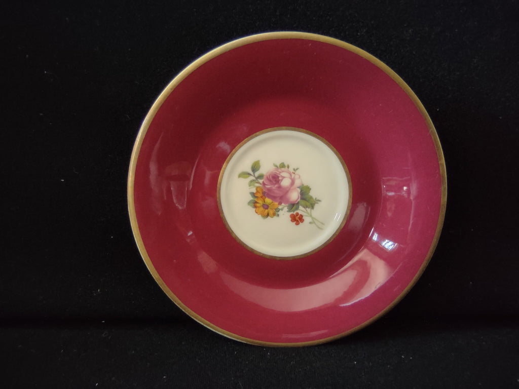 Vintage Syracuse China Old Ivory saucer with deep raspberry pink ground, white center medallion with pink rose, yellow daisy and red berries bouquet, gold rim, approximately 5.5 inches diameter