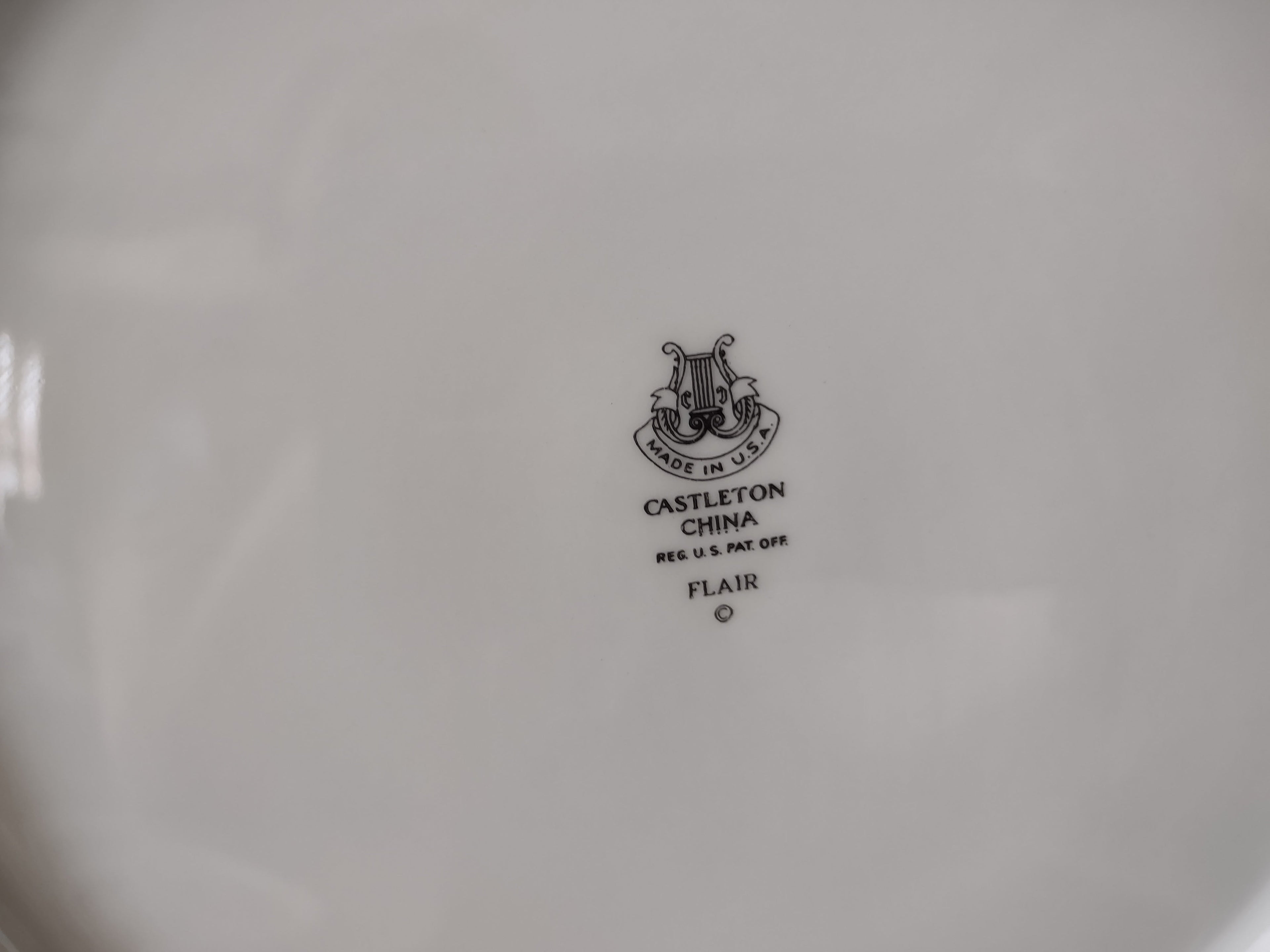 Castleton China Flair plate with ruler showing approximately 9 inch diameter
