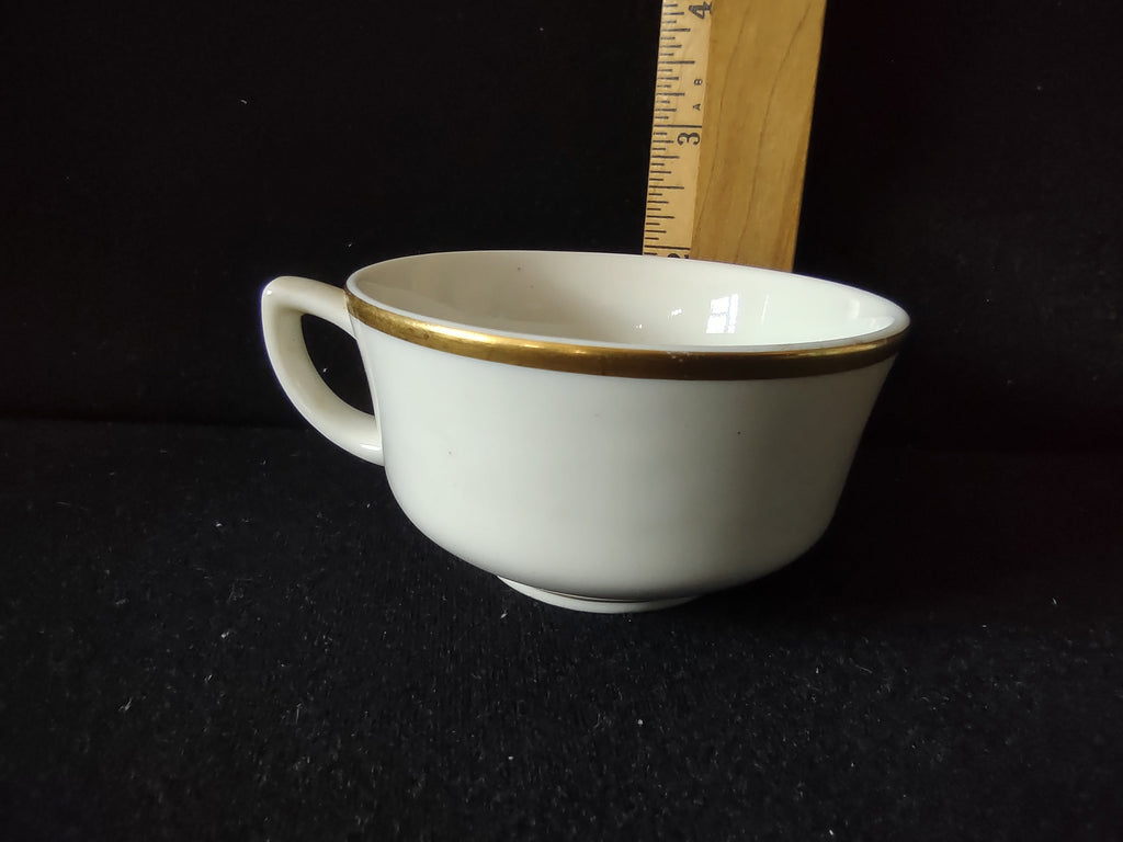 Close-up showing discoloration on body of tea cup consistent with age