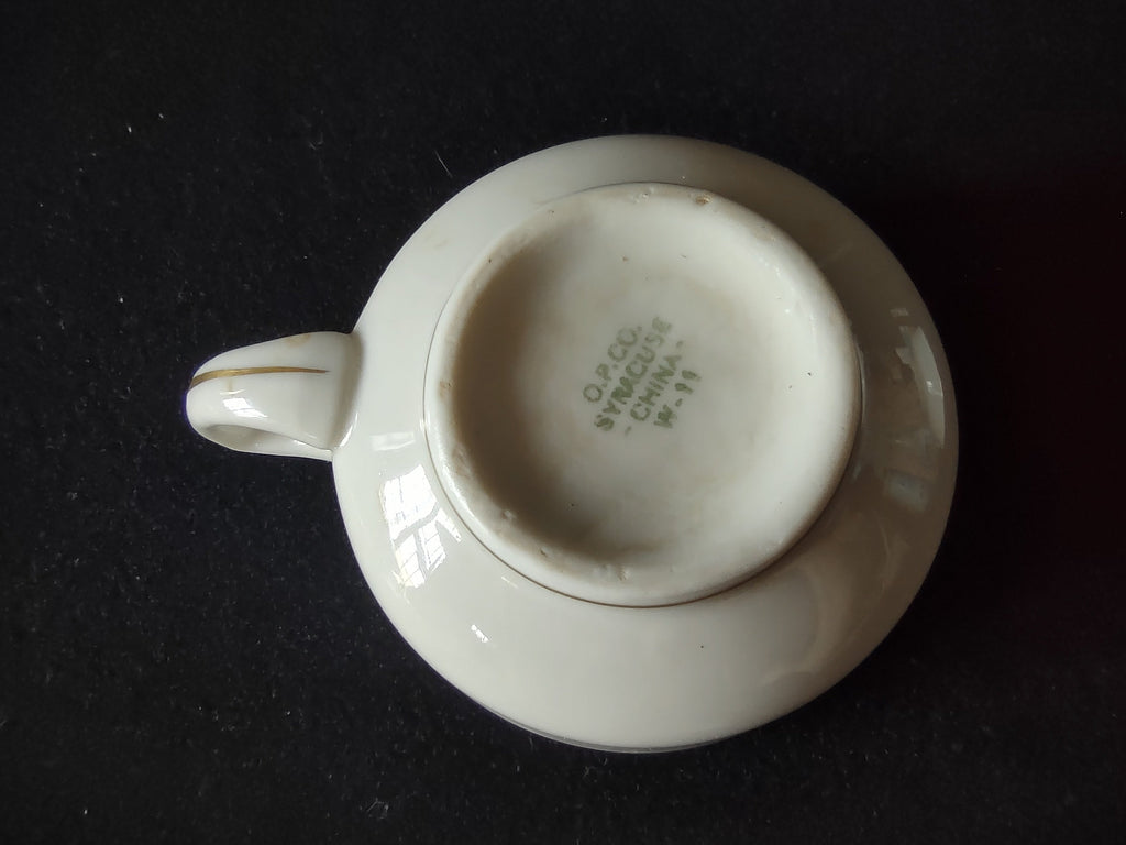 Close-up of handle and gold band detail on Syracuse China tea cup