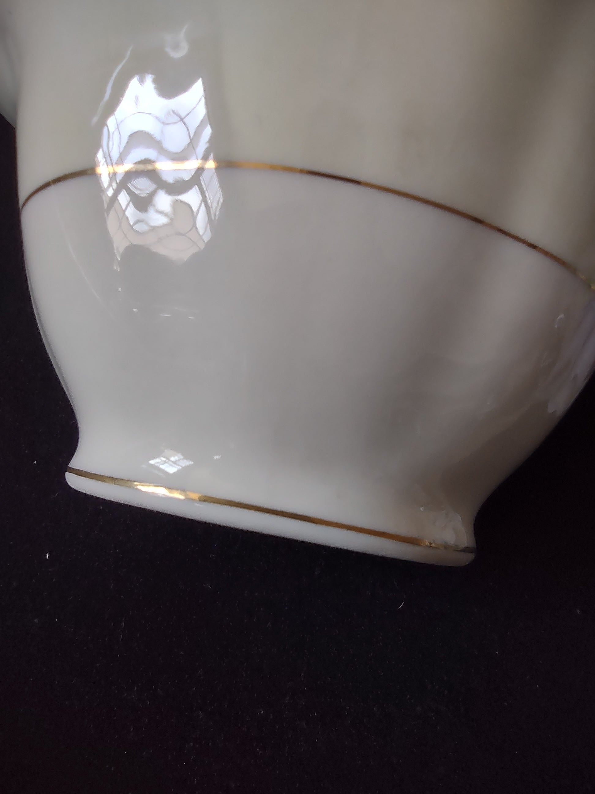 Vintage Theodore Haviland Leeds cream soup bowl top view with two gold handles