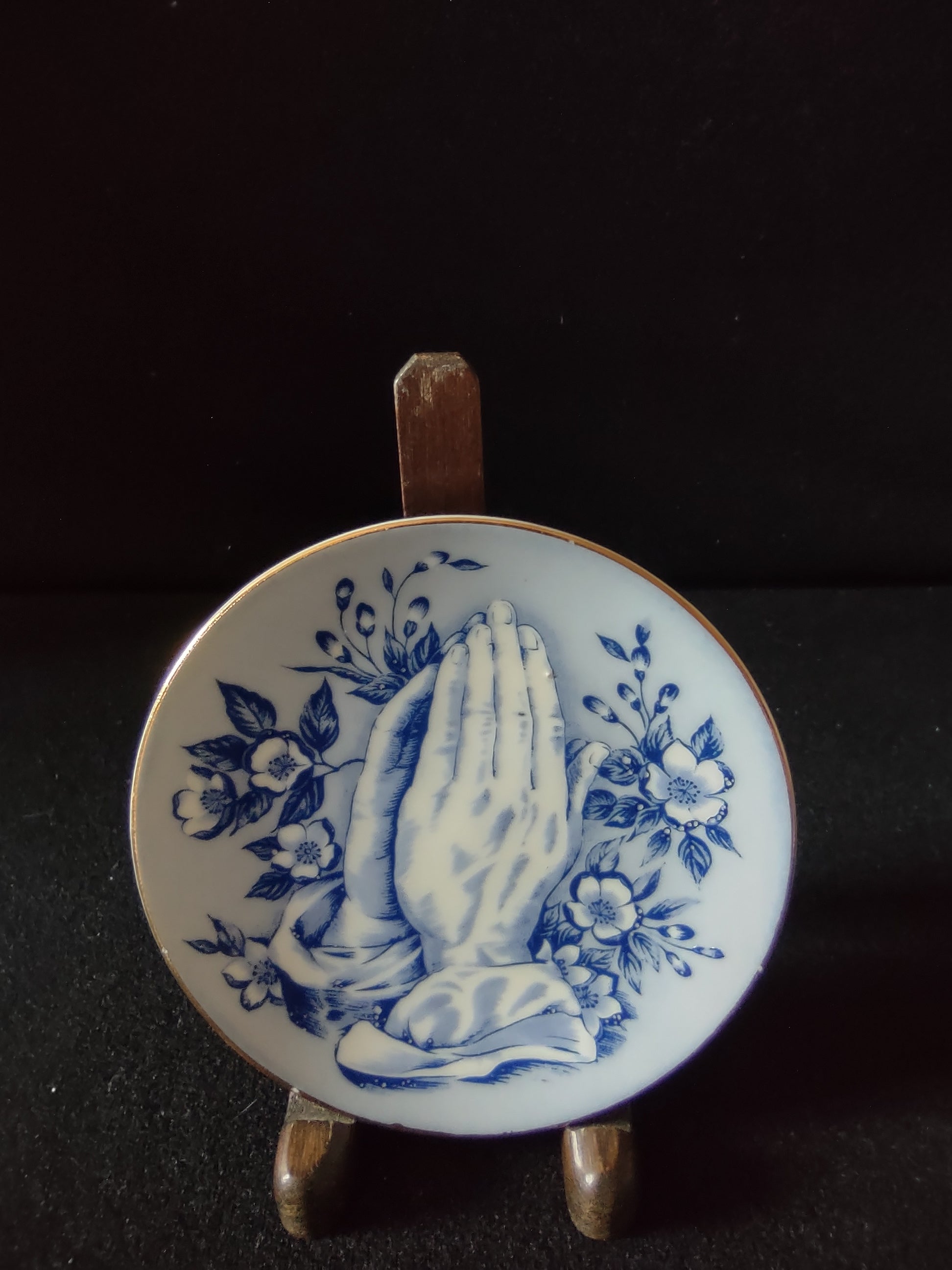 Vintage blue white praying hands floral wall plate front view