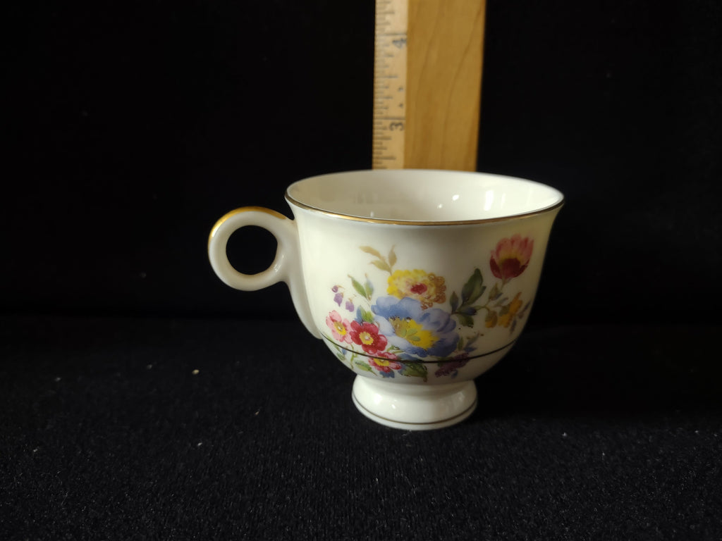 Vintage Theodore Haviland Pasadena teacup with ruler showing approximately 2.5 inch height