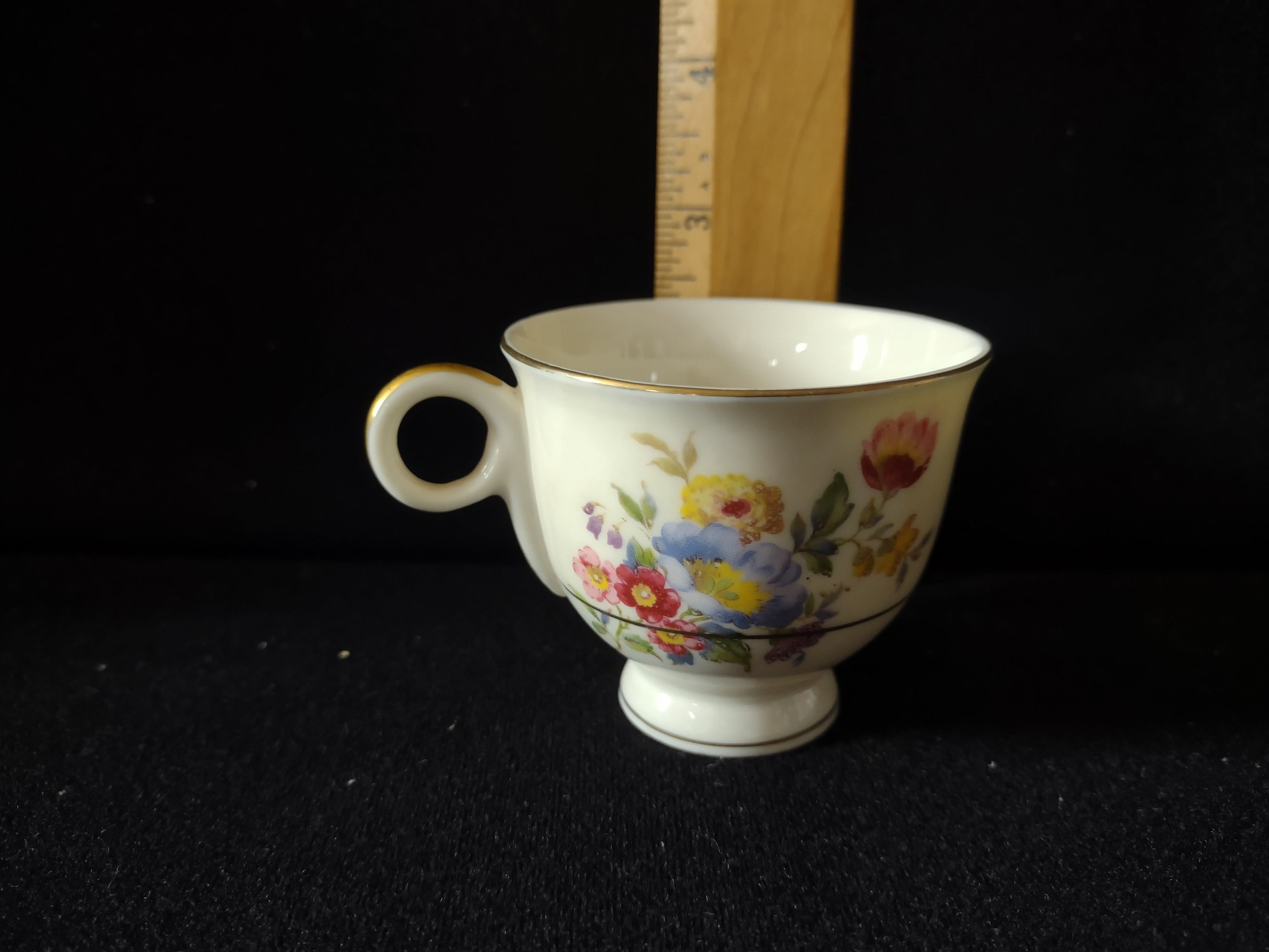 Vintage Theodore Haviland Pasadena teacup with ruler showing approximately 2.5 inch height