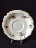 Vintage Theodore Haviland Limoges saucer with scattered rose floral pattern and ruler showing 5.5 inch diameter
