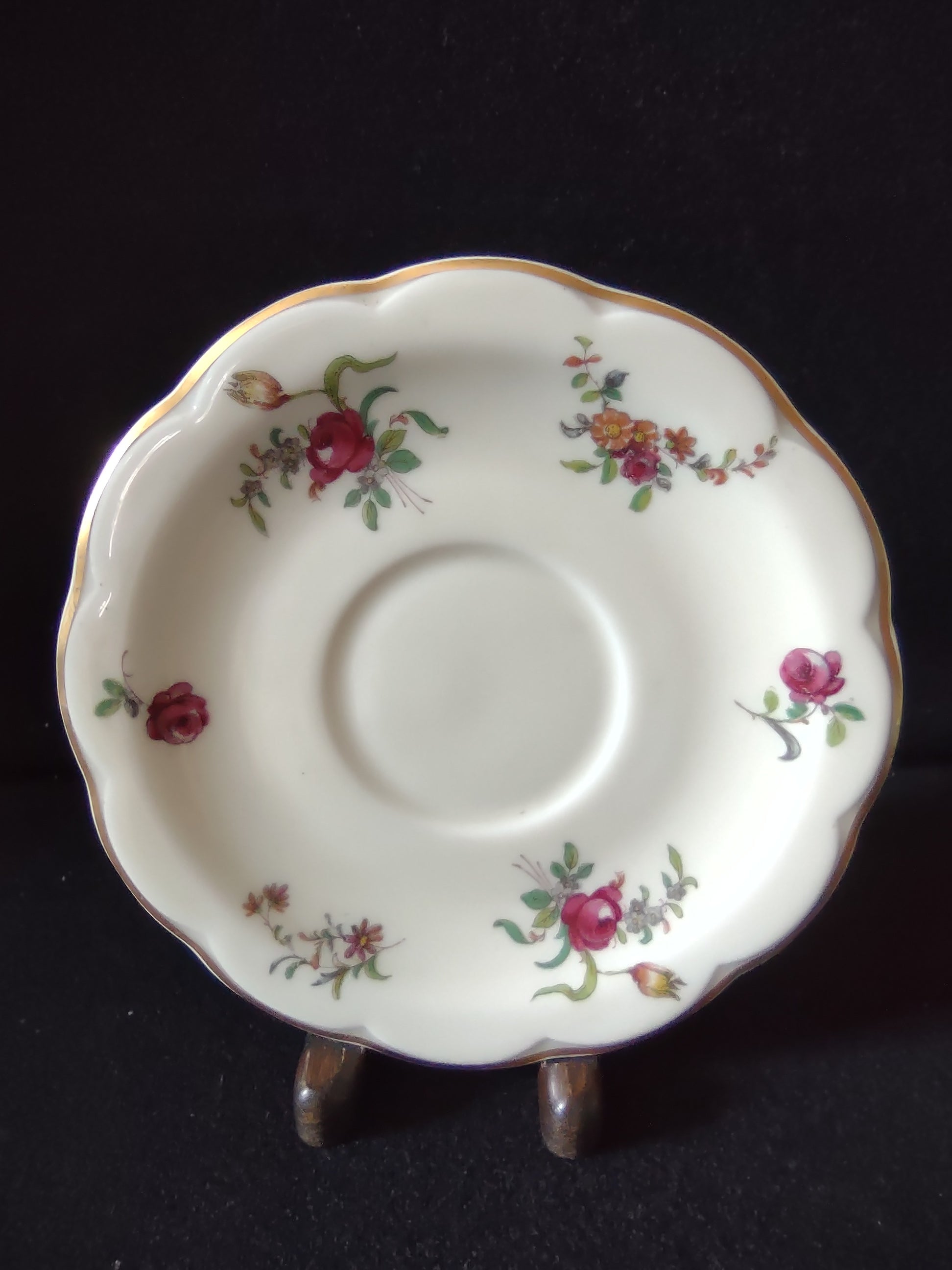 Vintage Theodore Haviland Limoges saucer with scattered rose floral pattern and ruler showing 5.5 inch diameter