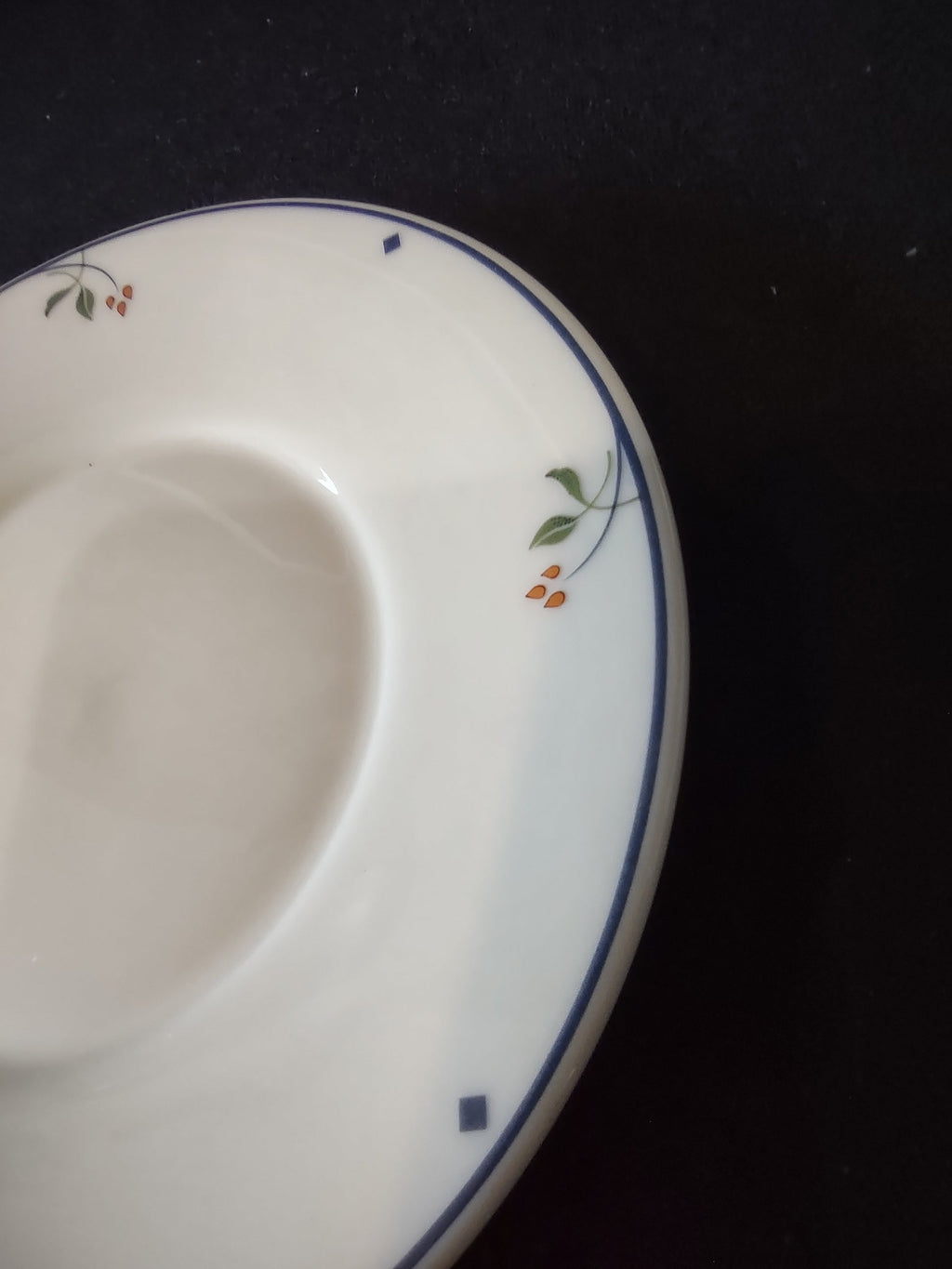 Gorham Ariana cup side view showing botanical motif and navy banding