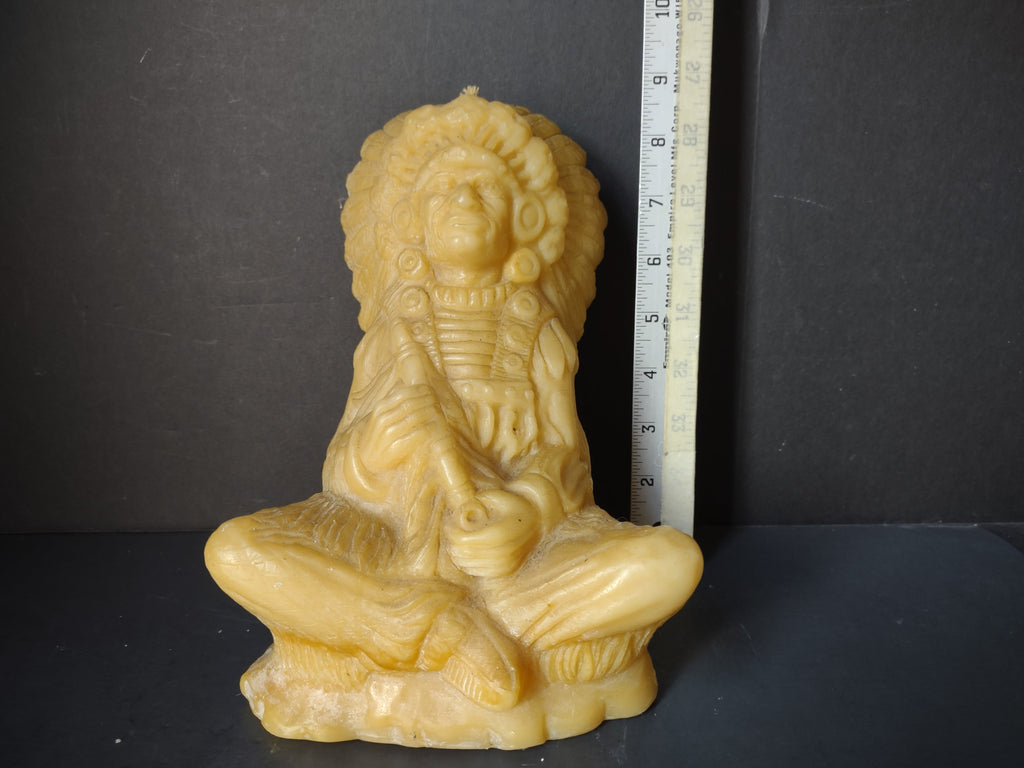 Vintage beeswax Native American chief seated figure candle, approximately 8-9 inches tall