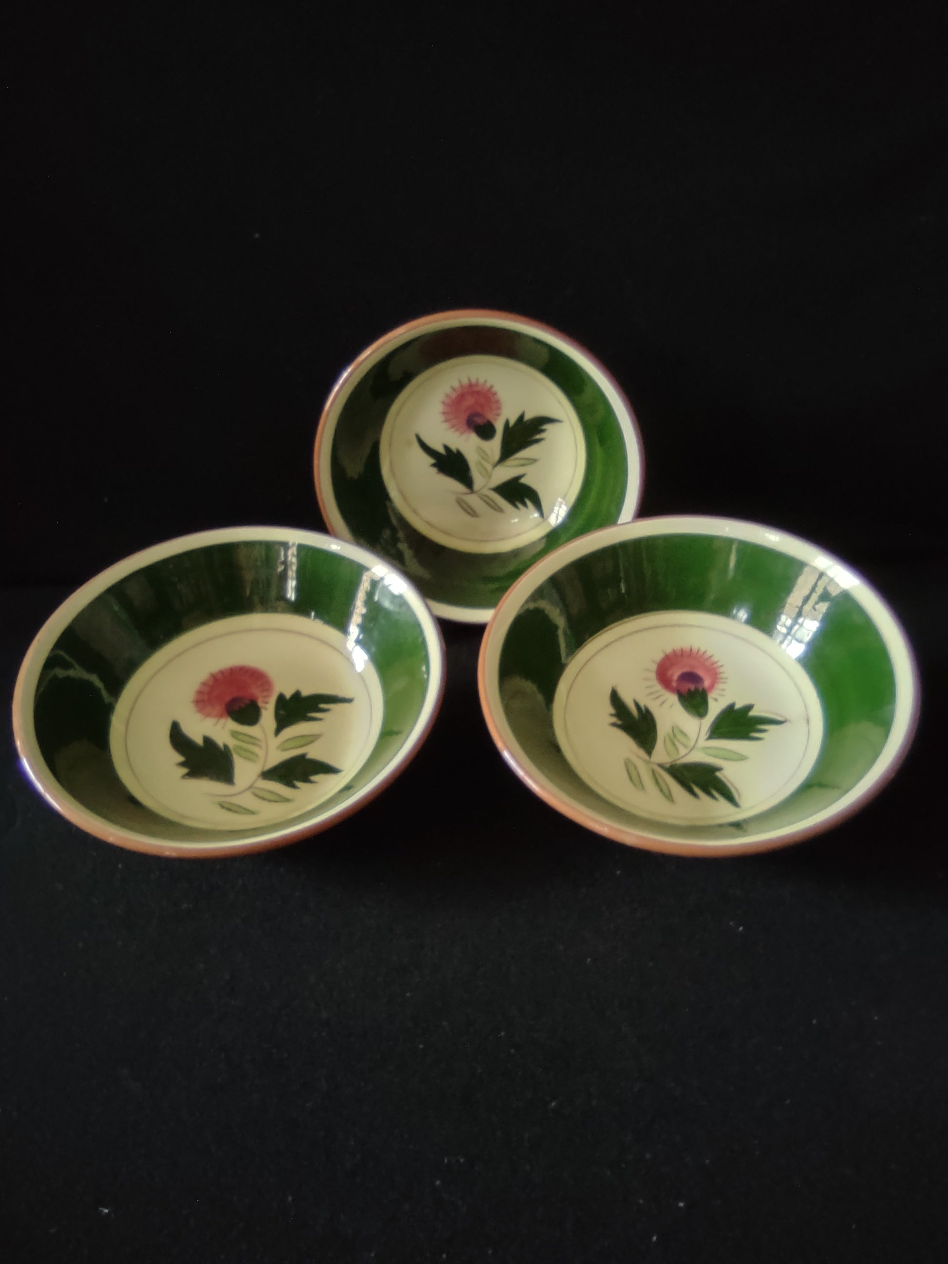 Stangl Pottery Thistle fruit bowl top view showing pink thistle bloom and green leaves