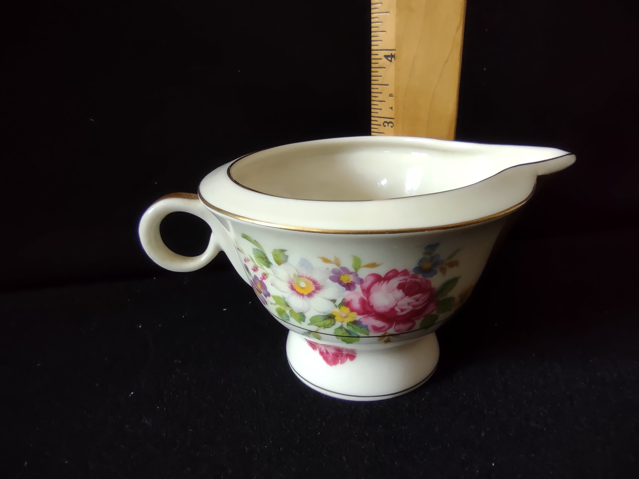 Theodore Haviland Pasadena creamer side view showing floral pattern