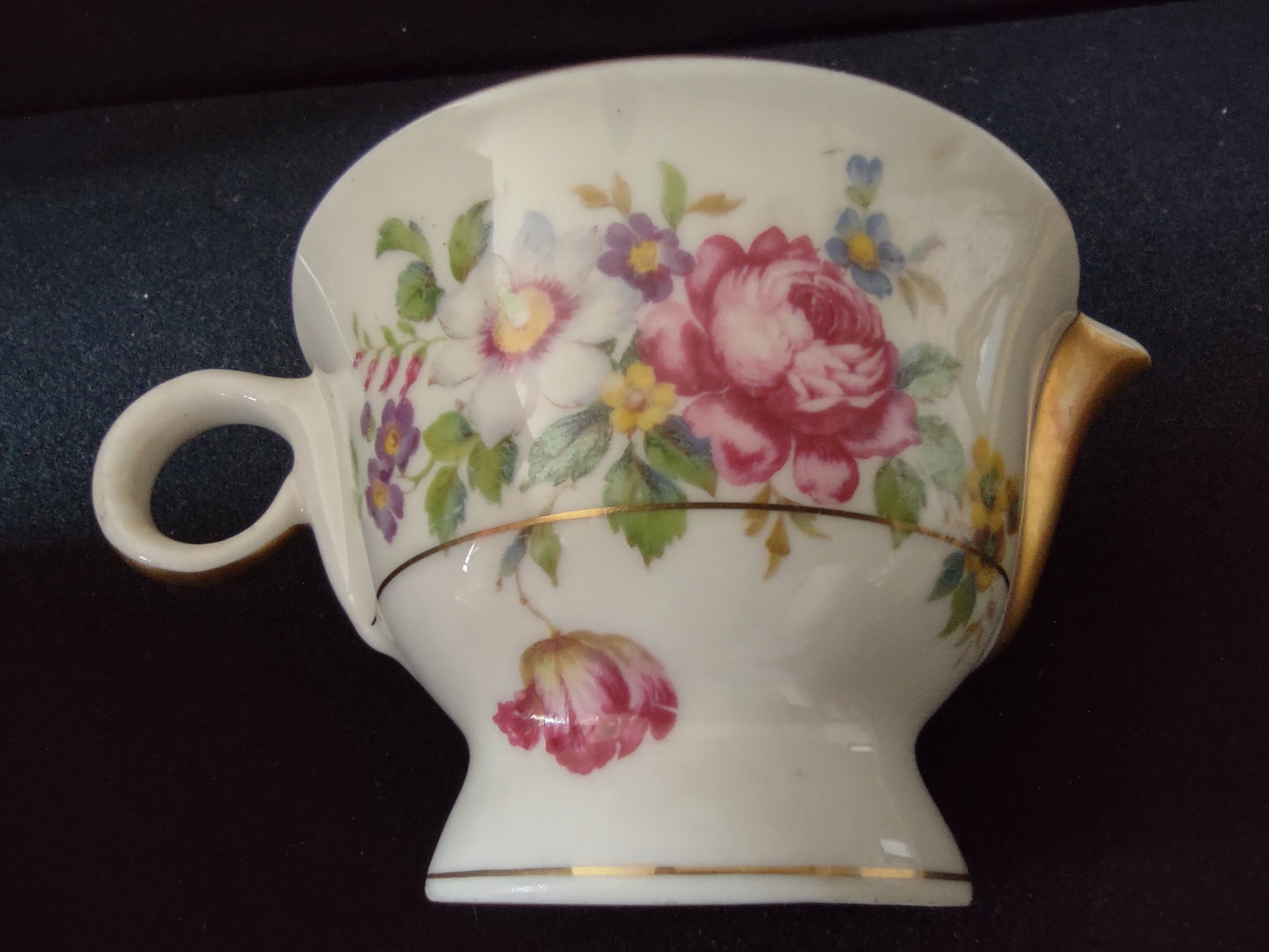 Theodore Haviland Pasadena creamer handle side view with gold trim