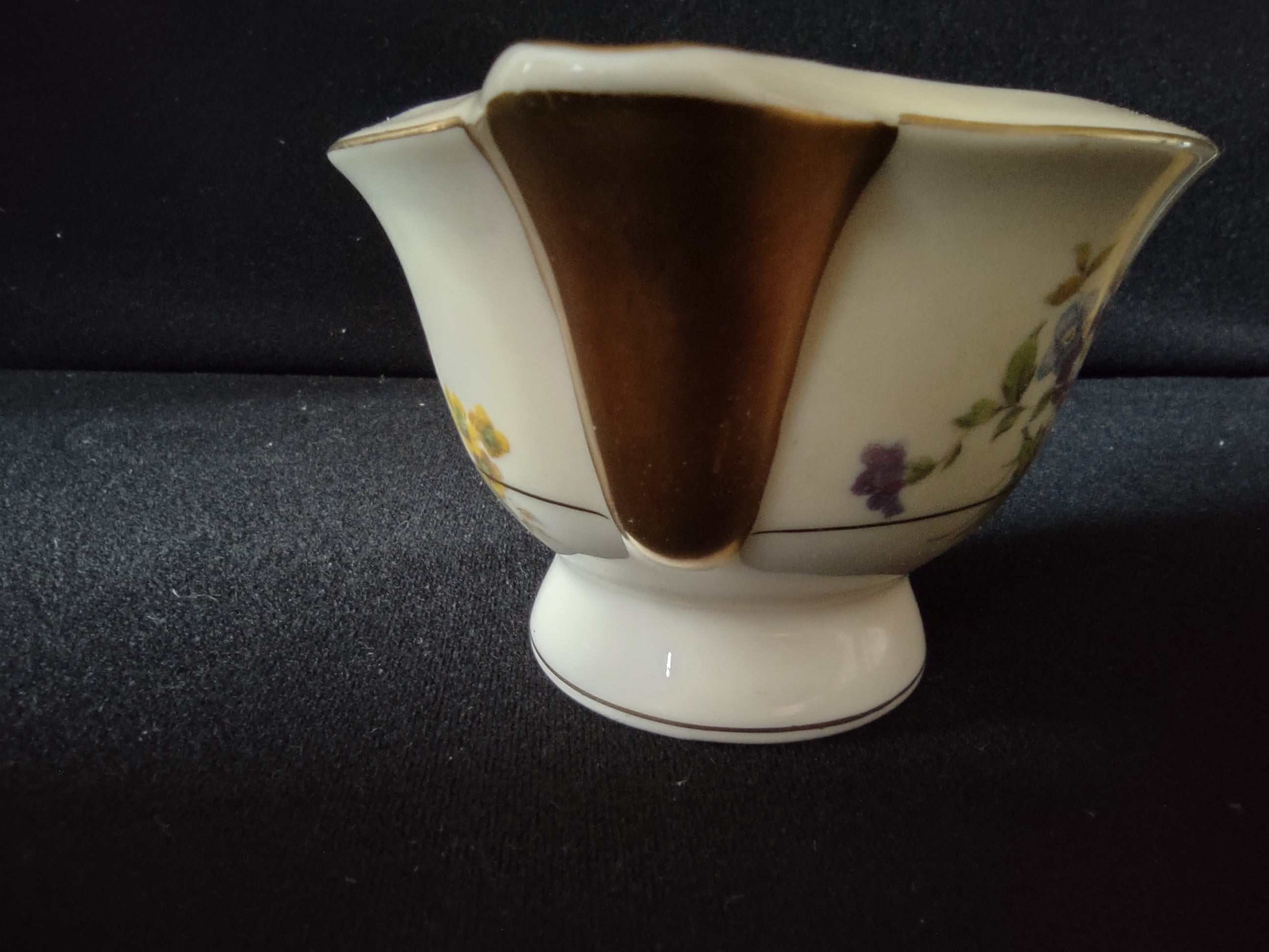 Theodore Haviland Pasadena creamer spout side view showing chip