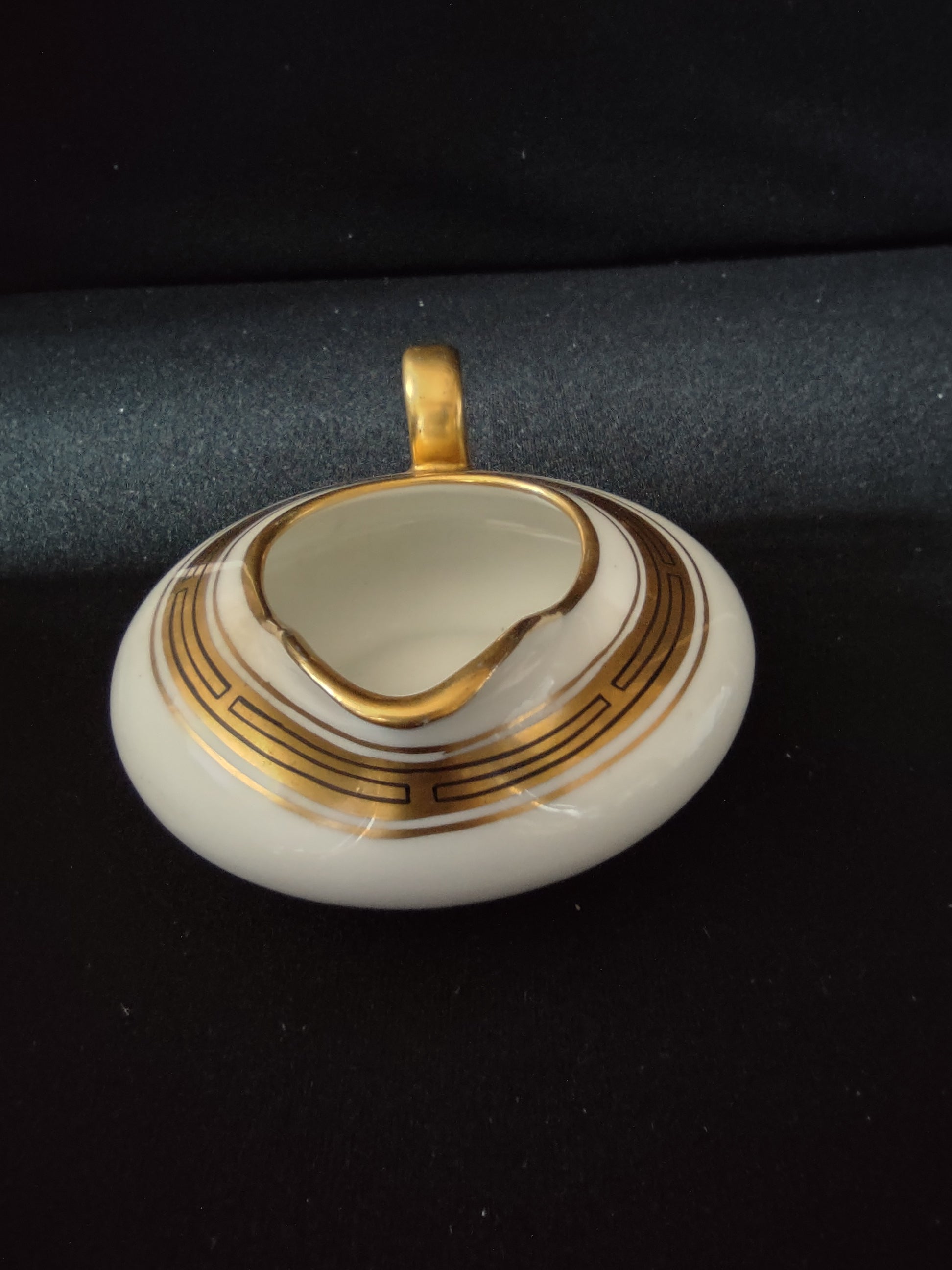Limoges France creamer angled view showing gold handle