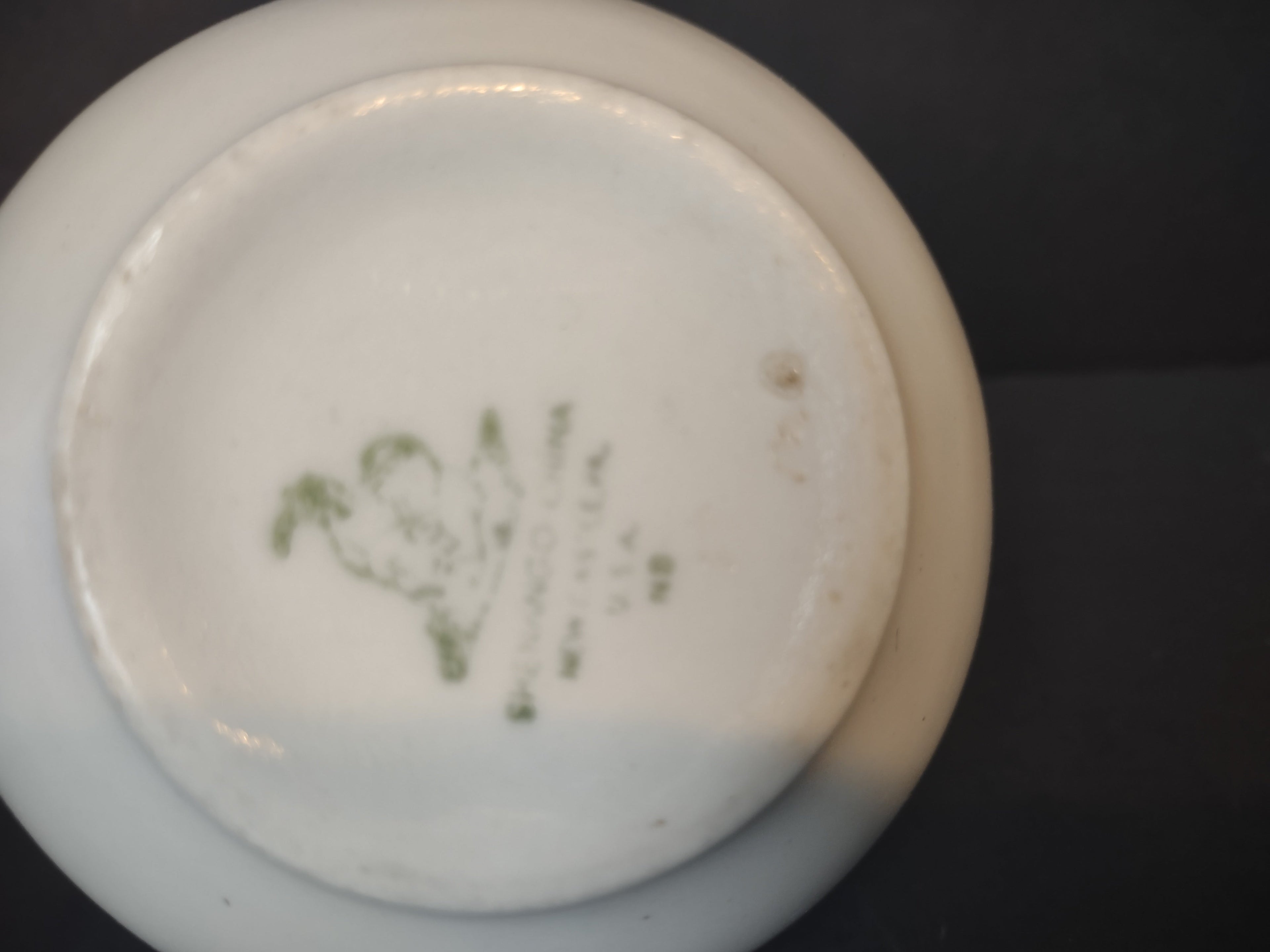 Backstamp of Vintage red transferware rose garland gravy boat showing green script maker mark