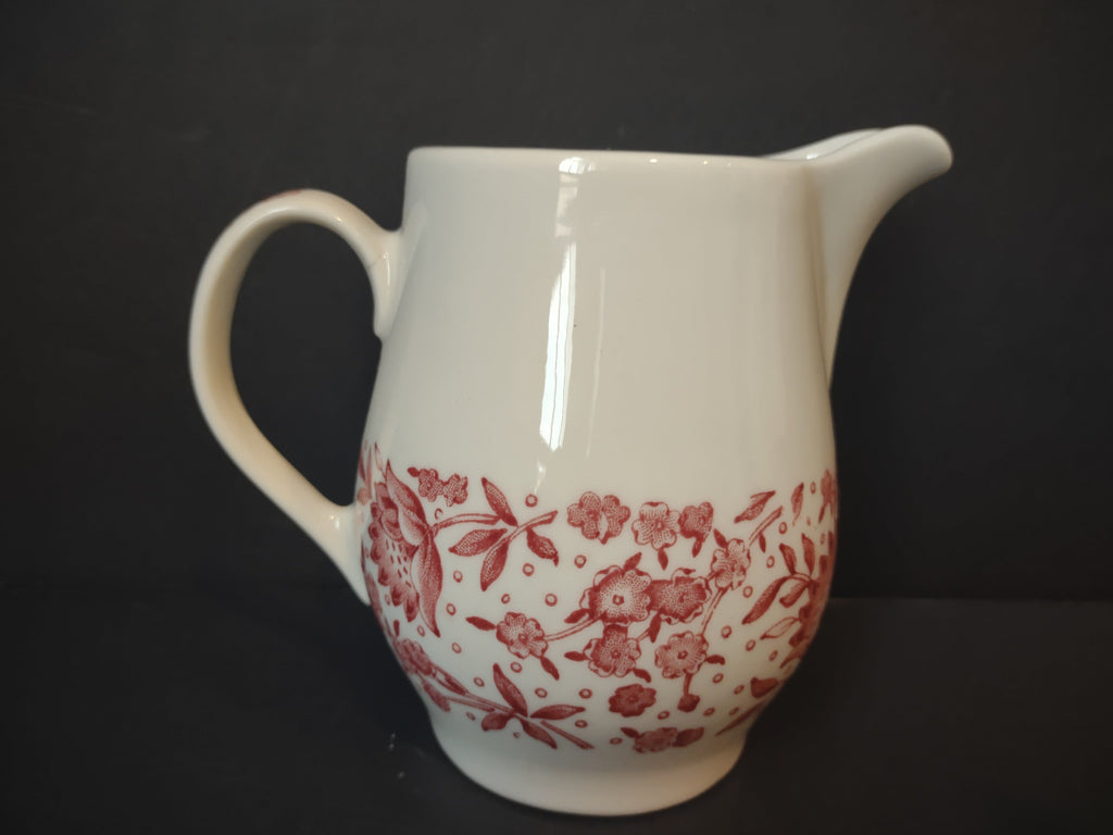 Measurement view of Vintage Syracuse China Carefree Mayflower creamer pitcher showing approximately 5 inch height