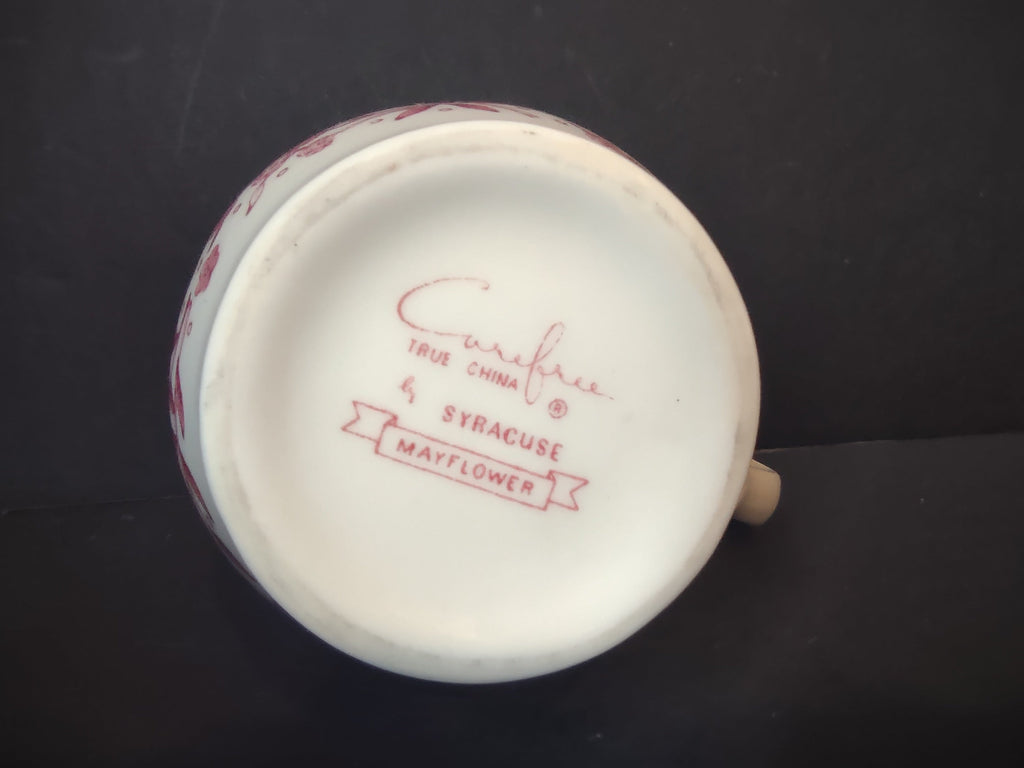 Backstamp of Vintage Syracuse China Carefree True China Mayflower pattern mark in cranberry pink