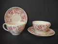 Two Vintage Syracuse China Carefree Mayflower pink floral cup and saucer sets displayed together showing all-over cranberry floral pattern