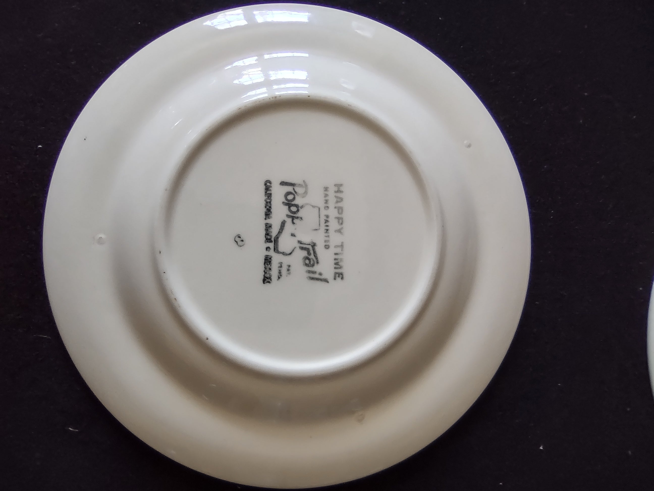 Bottom of Metlox Poppytrail Happy Time saucer showing Poppytrail Made in California backstamp