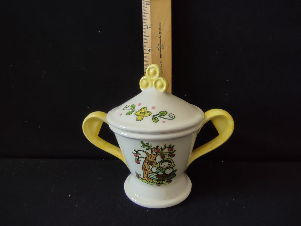 Metlox Poppytrail folk art sugar bowl with lid - apple-picking girl side