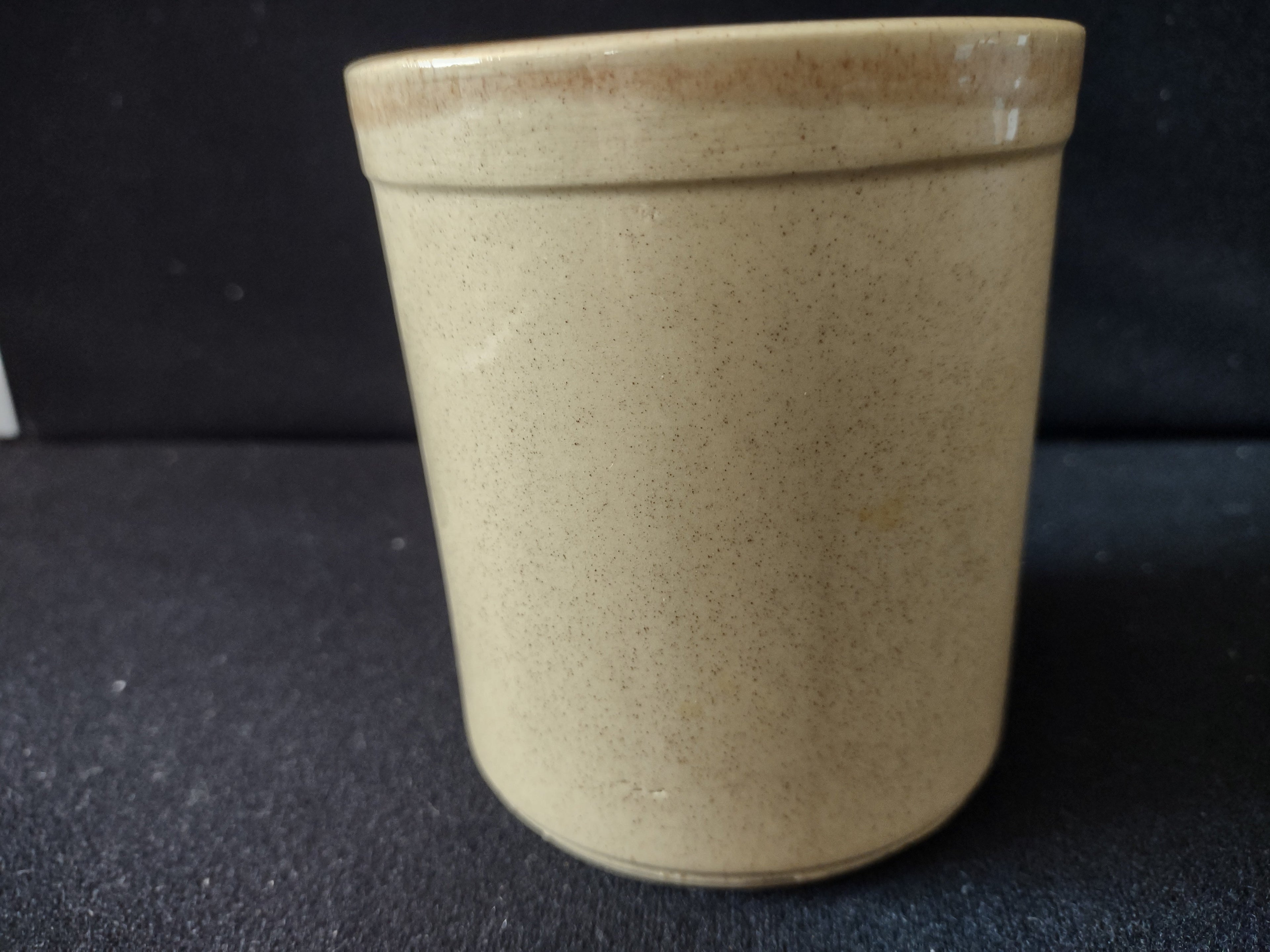 Bottom of vintage stoneware crock showing artist signature Bk 92