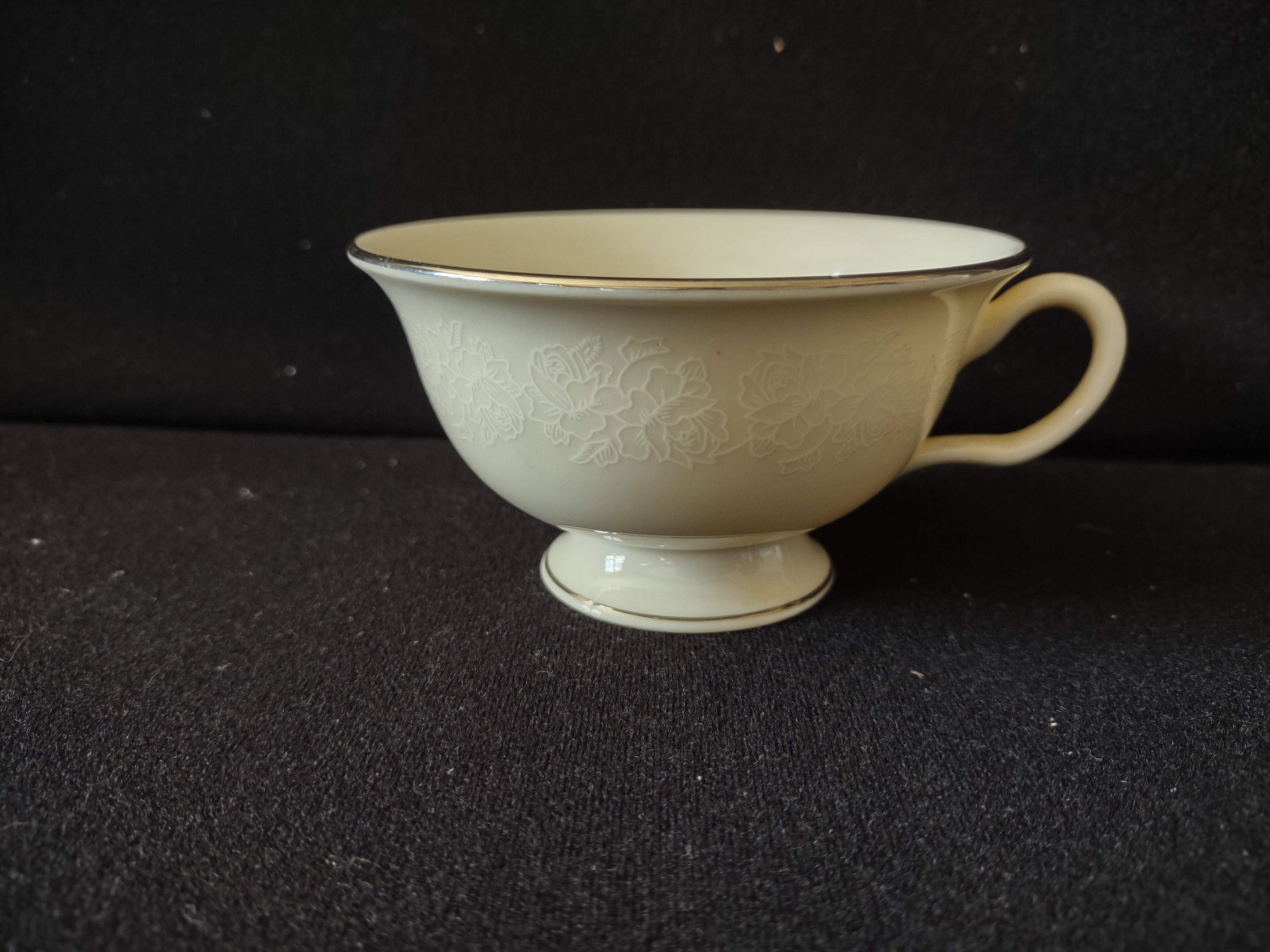Vintage Cathedral Fine China footed teacup side view showing embossed rose pattern and platinum trim