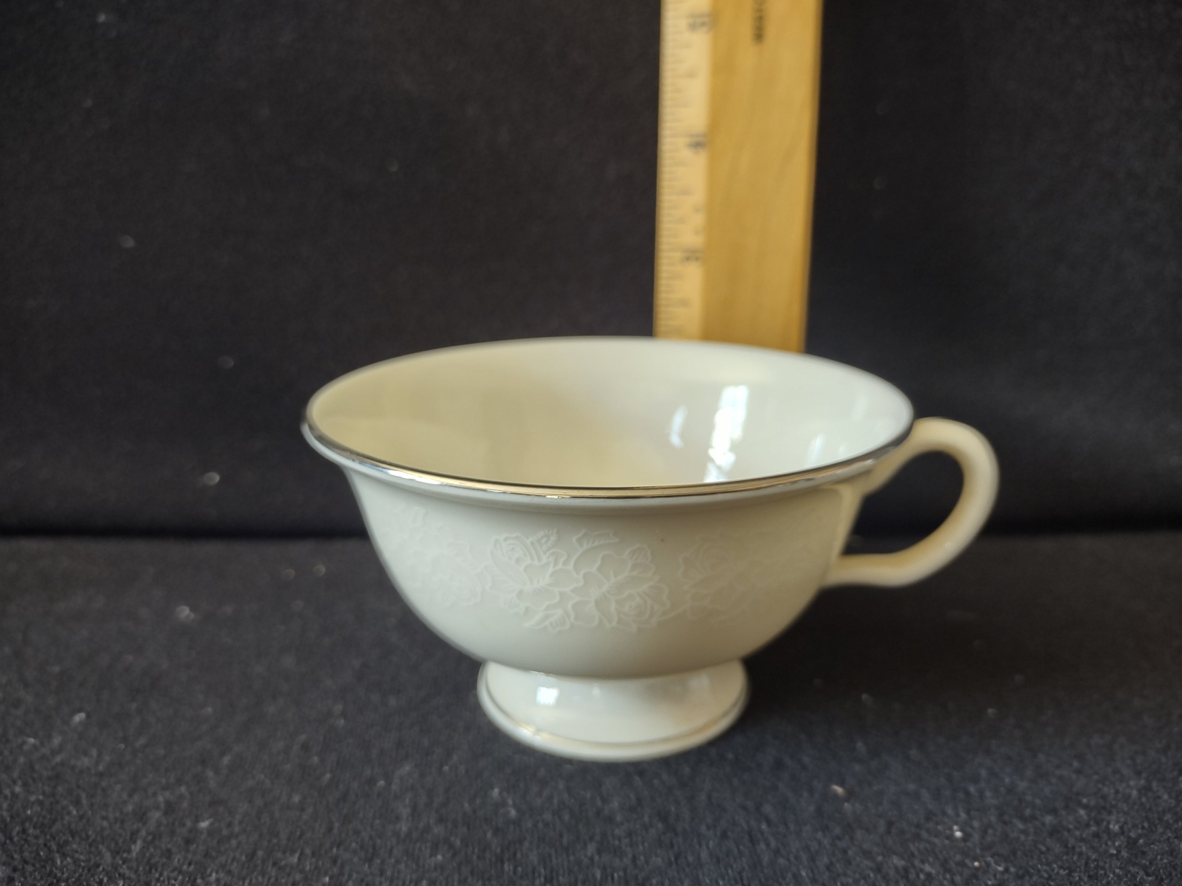 Vintage Cathedral Fine China footed teacup side view with ruler showing approximately 3 inches tall