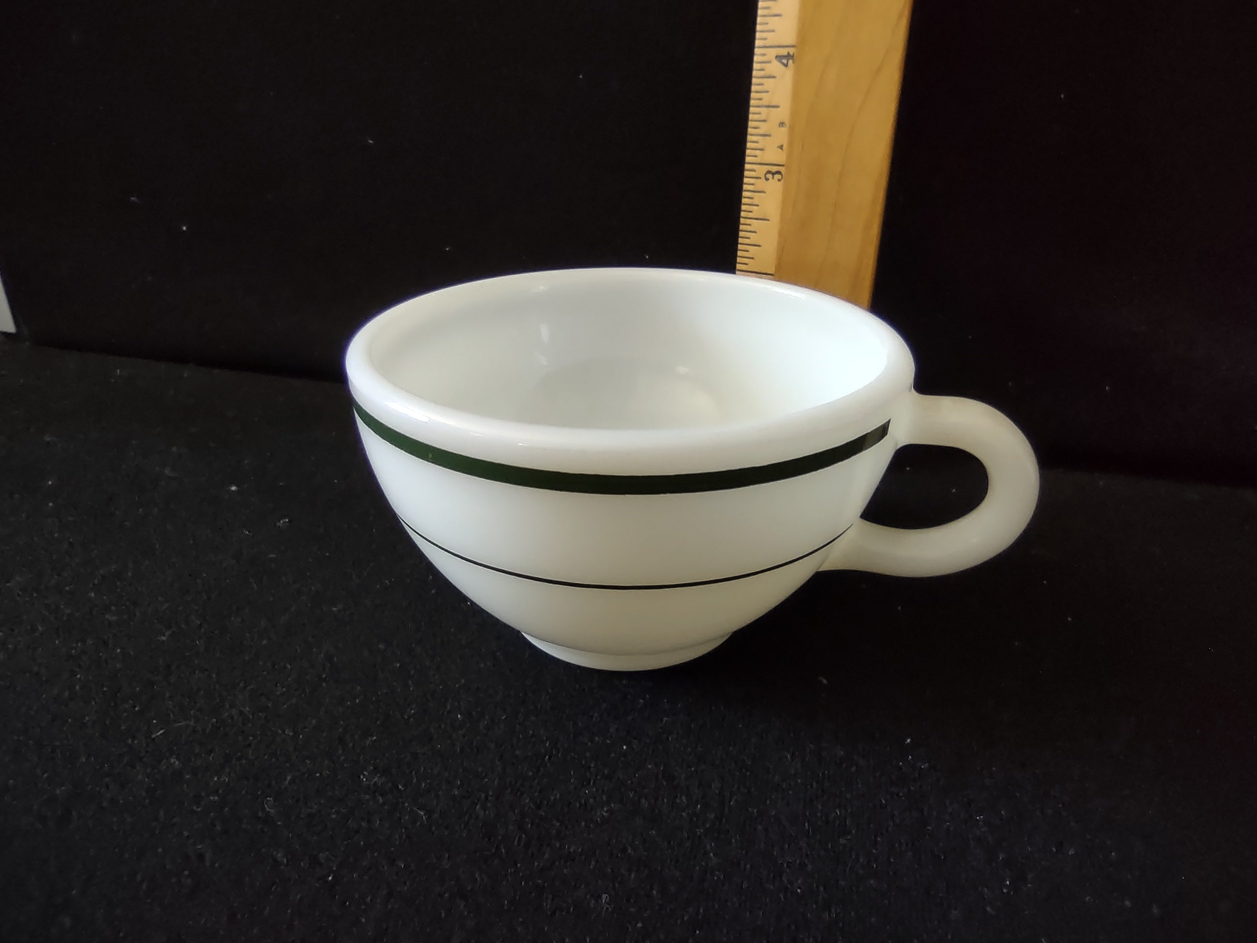 Interior view of vintage Buffalo China white milk glass diner cup