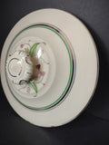 Vintage off-white banded plate back view with ruler showing approximately 10 inches diameter