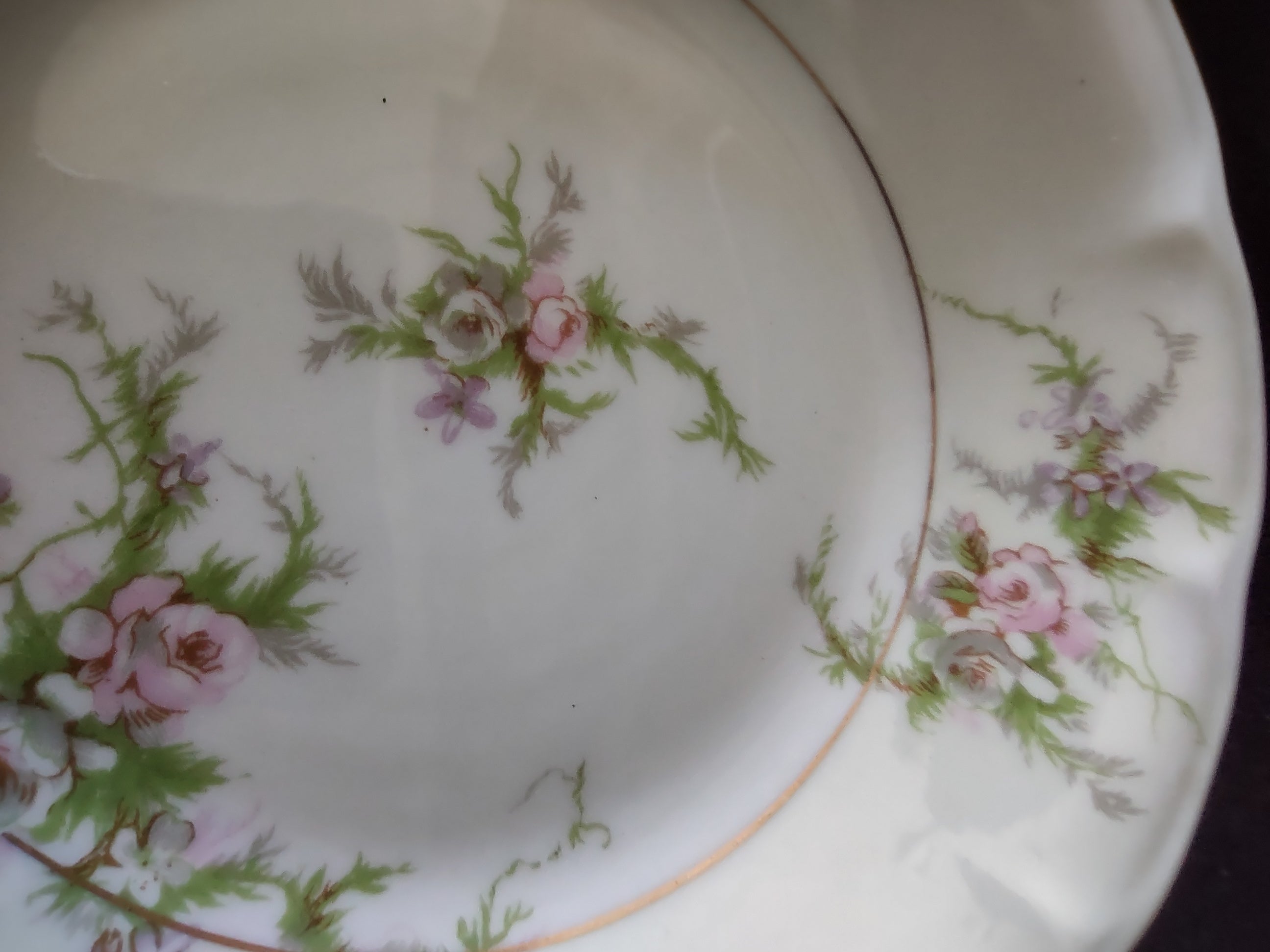 Theodore Haviland Rosalinde berry bowl showing scalloped rim and floral pattern detail