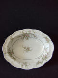 Close-up of pink and white floral spray on Theodore Haviland Rosalinde serving bowl rim