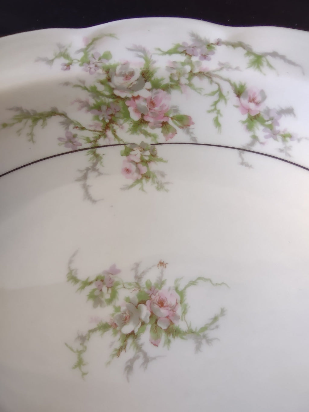 Vintage Theodore Haviland Rosalinde oval serving bowl side view showing scalloped rim and floral pattern