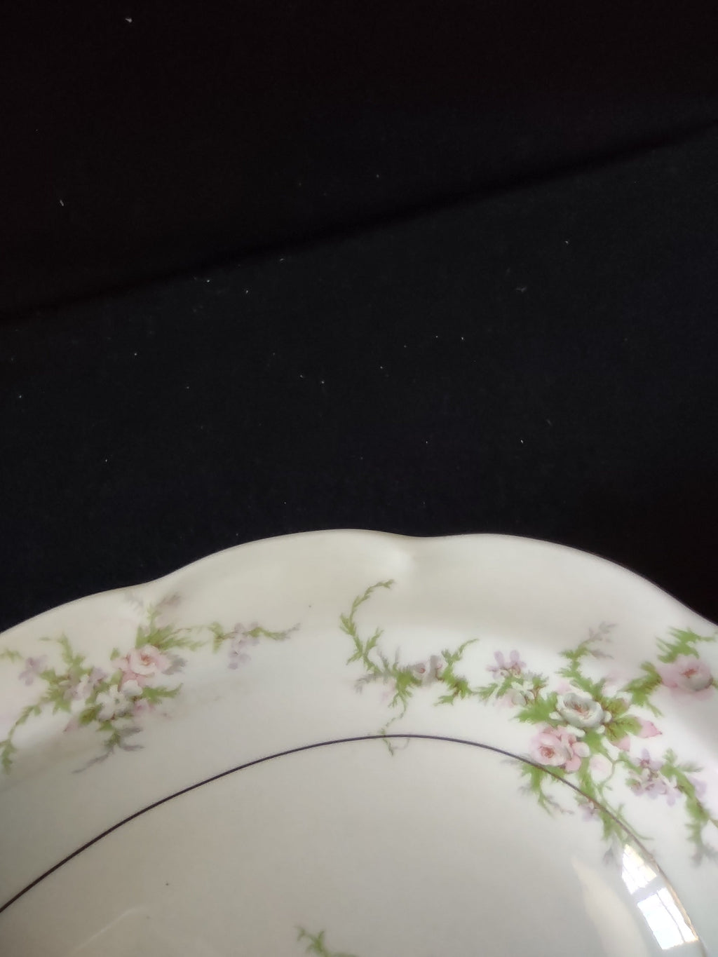 Theodore Haviland Rosalinde serving bowl showing scalloped edge and pink floral decoration