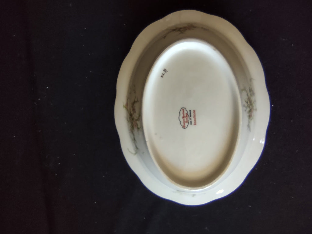 Theodore Haviland Rosalinde oval bowl interior showing age-appropriate discoloration in well