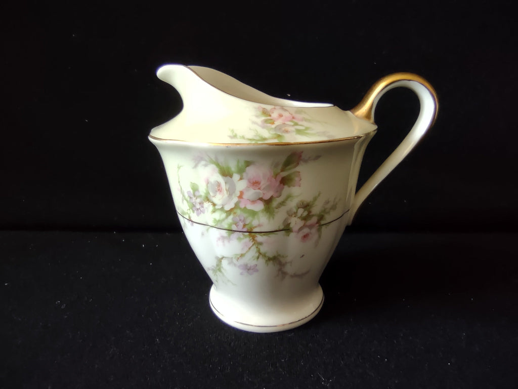 Vintage Theodore Haviland Rosalinde footed creamer side view with ruler showing approximately 4 inch height