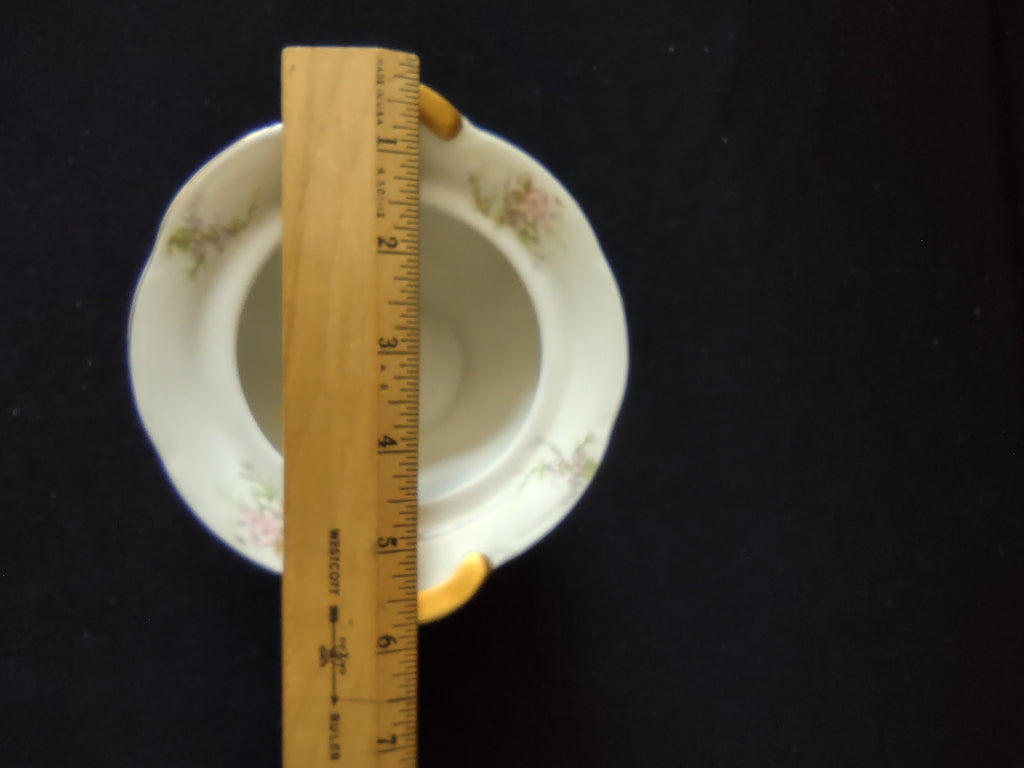 Theodore Haviland Rosalinde sugar bowl exterior showing pink floral pattern and crack