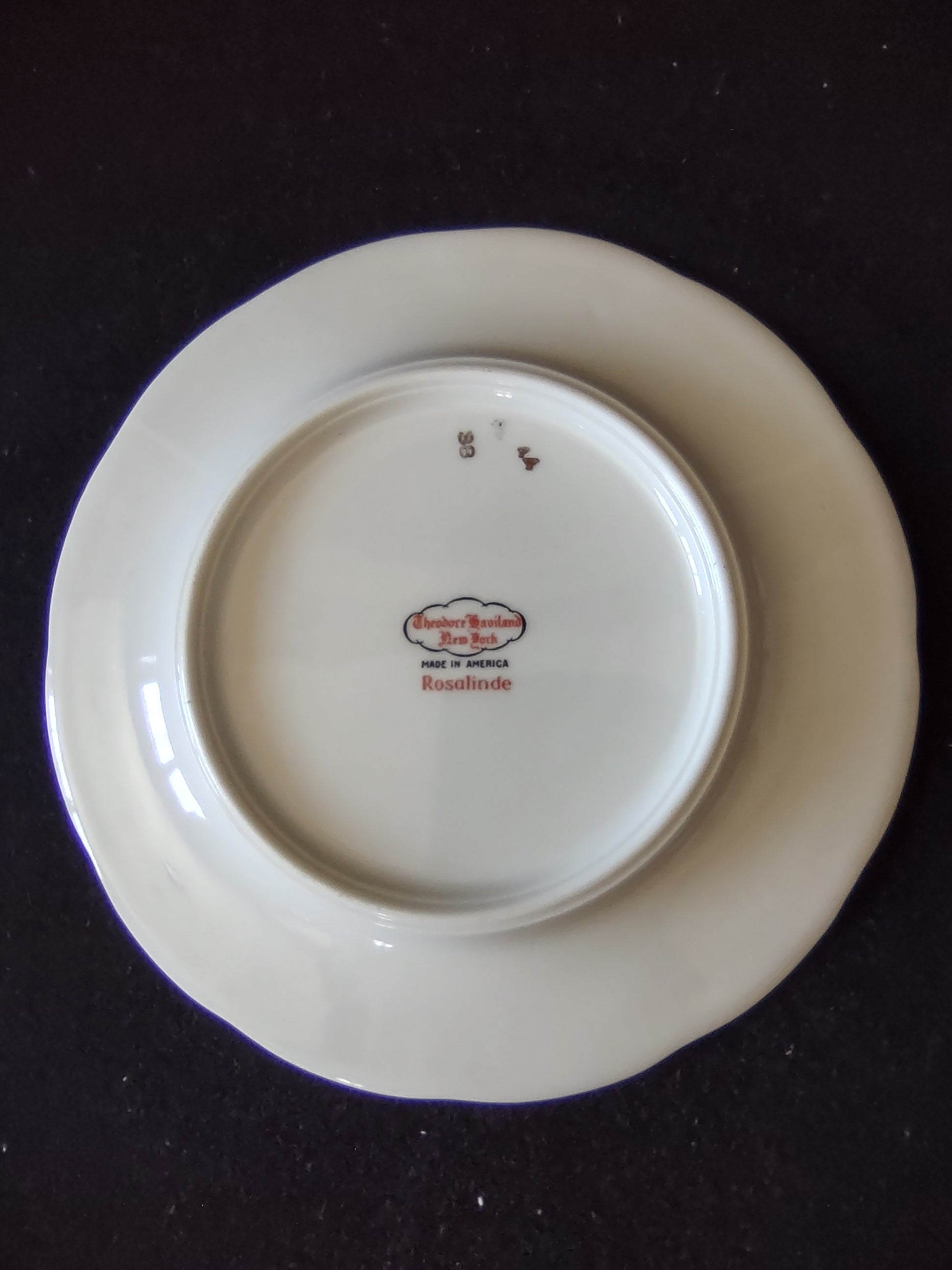 Set of 3 Theodore Haviland Rosalinde plates displayed on stands