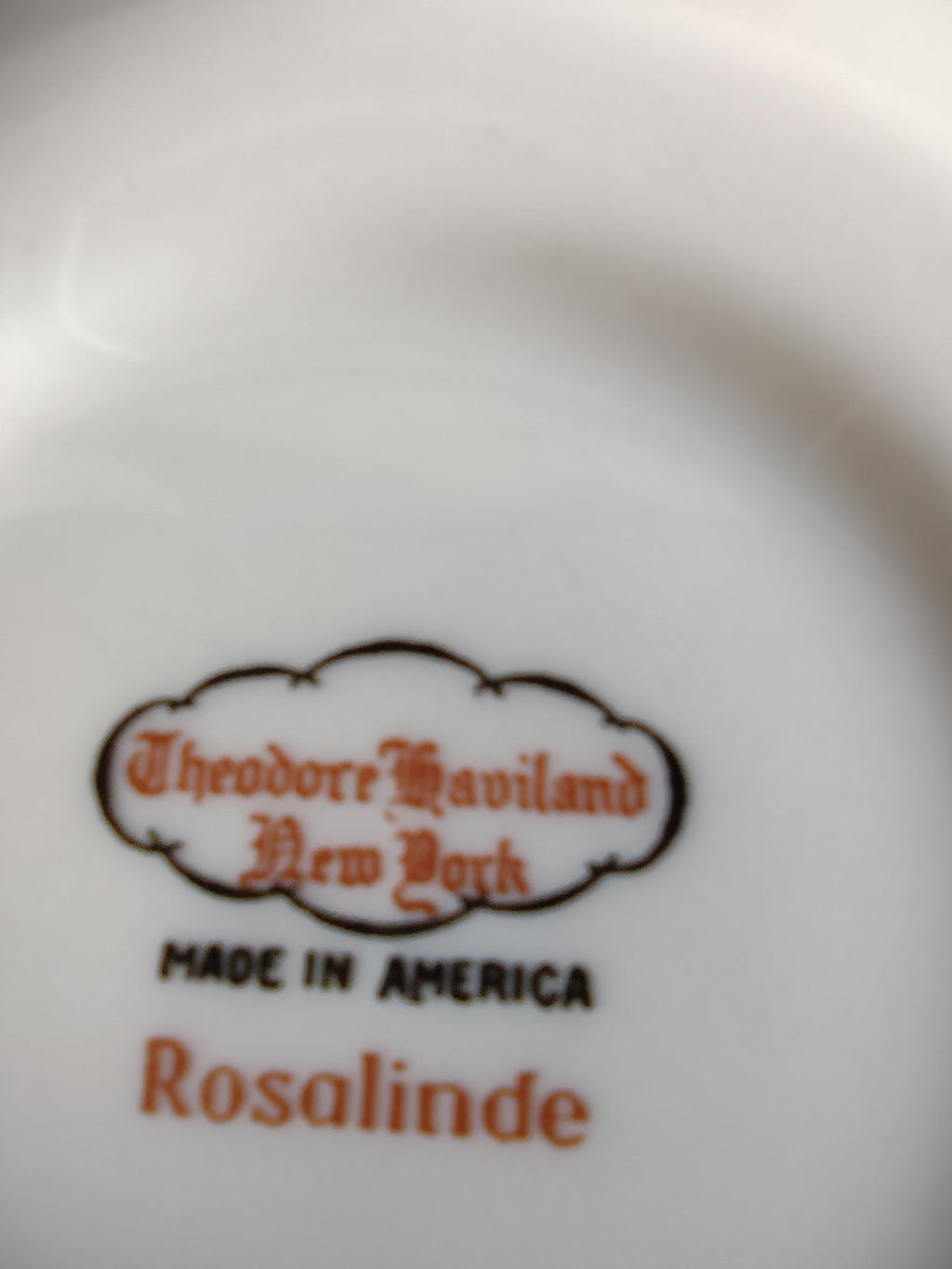 Theodore Haviland Rosalinde saucer top view showing scalloped edge and pink rose pattern