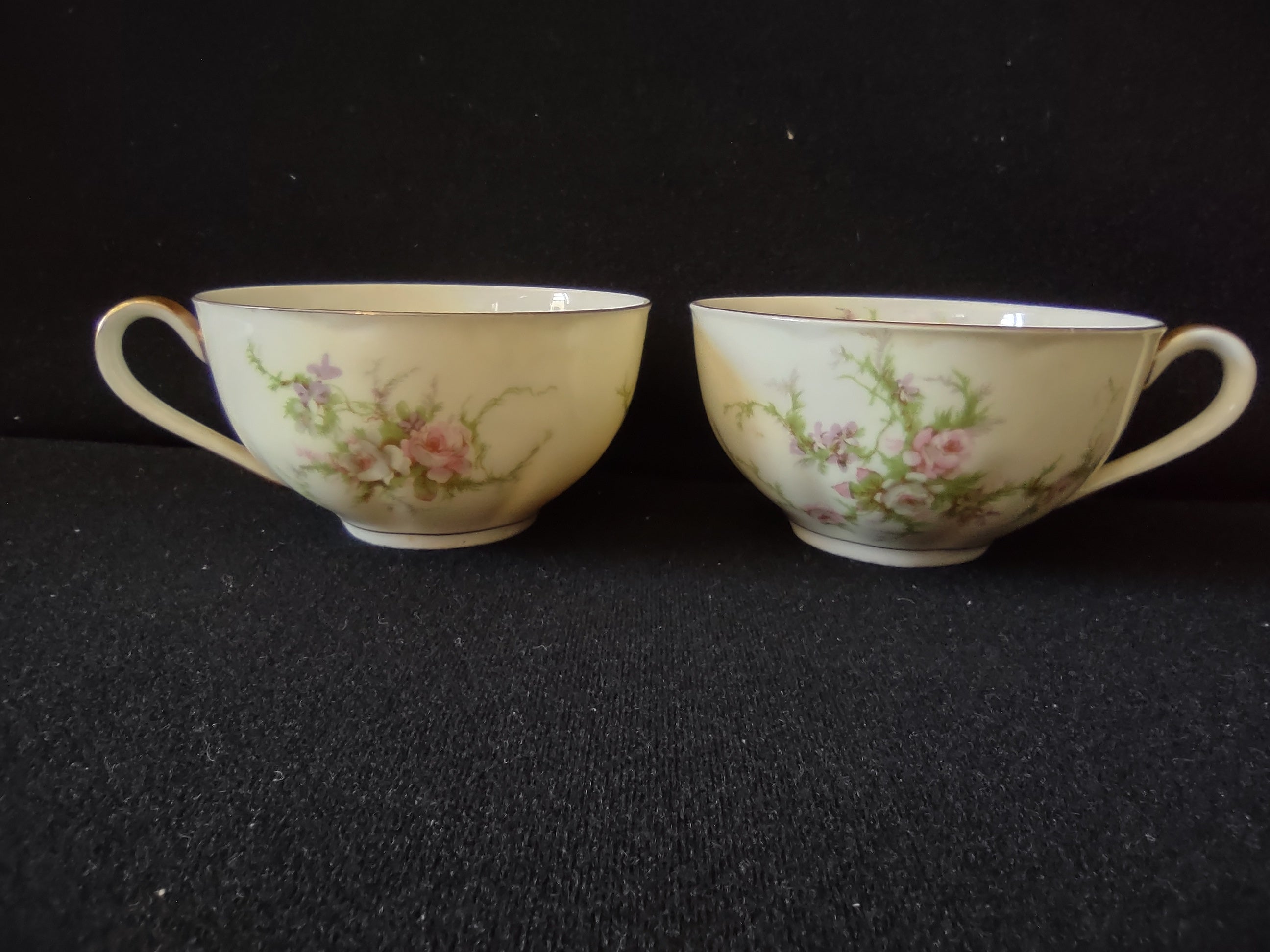 Theodore Haviland teacup interior view showing gold rim and pink rose spray