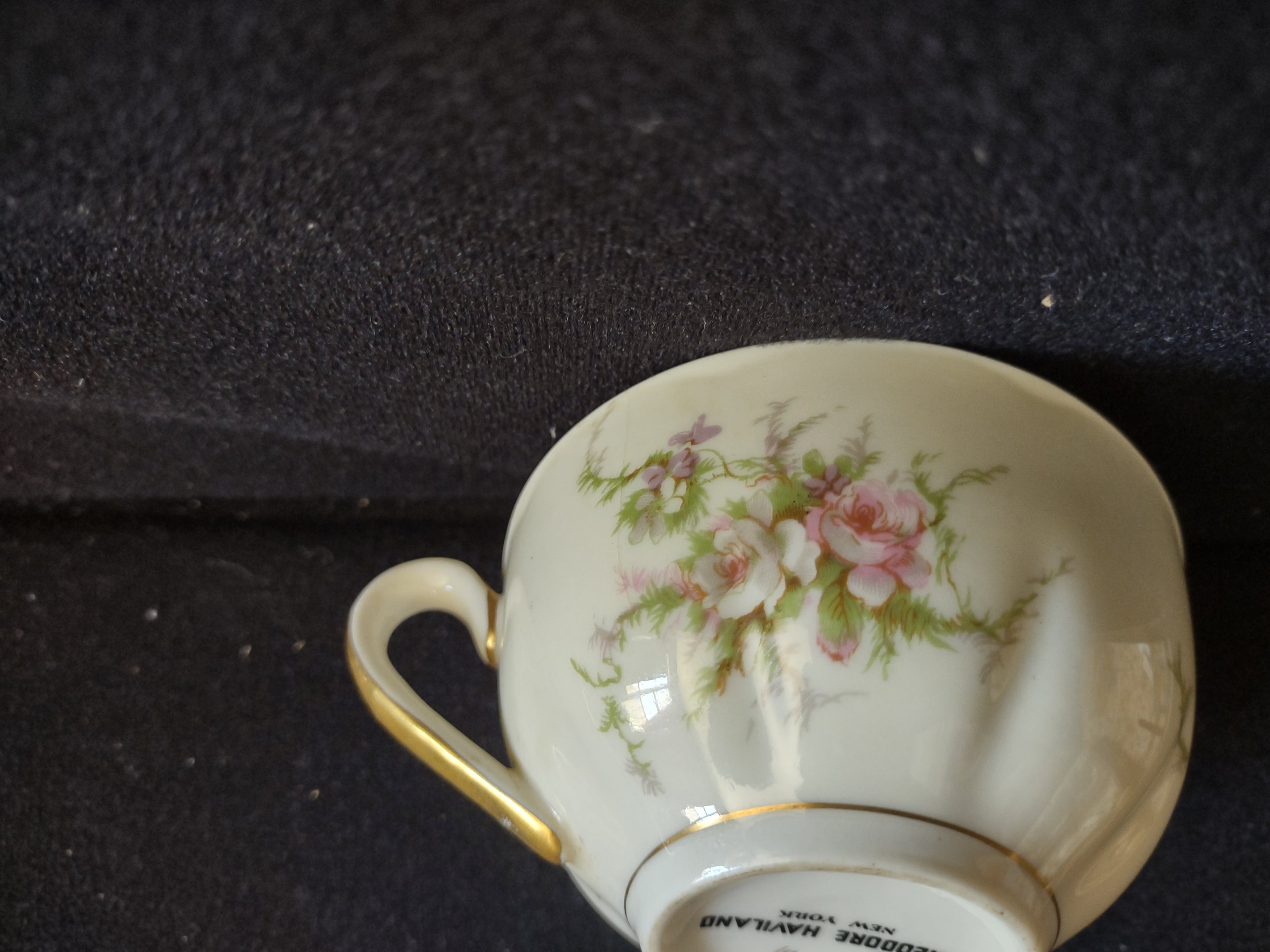 Theodore Haviland teacup exterior showing full pink rose pattern