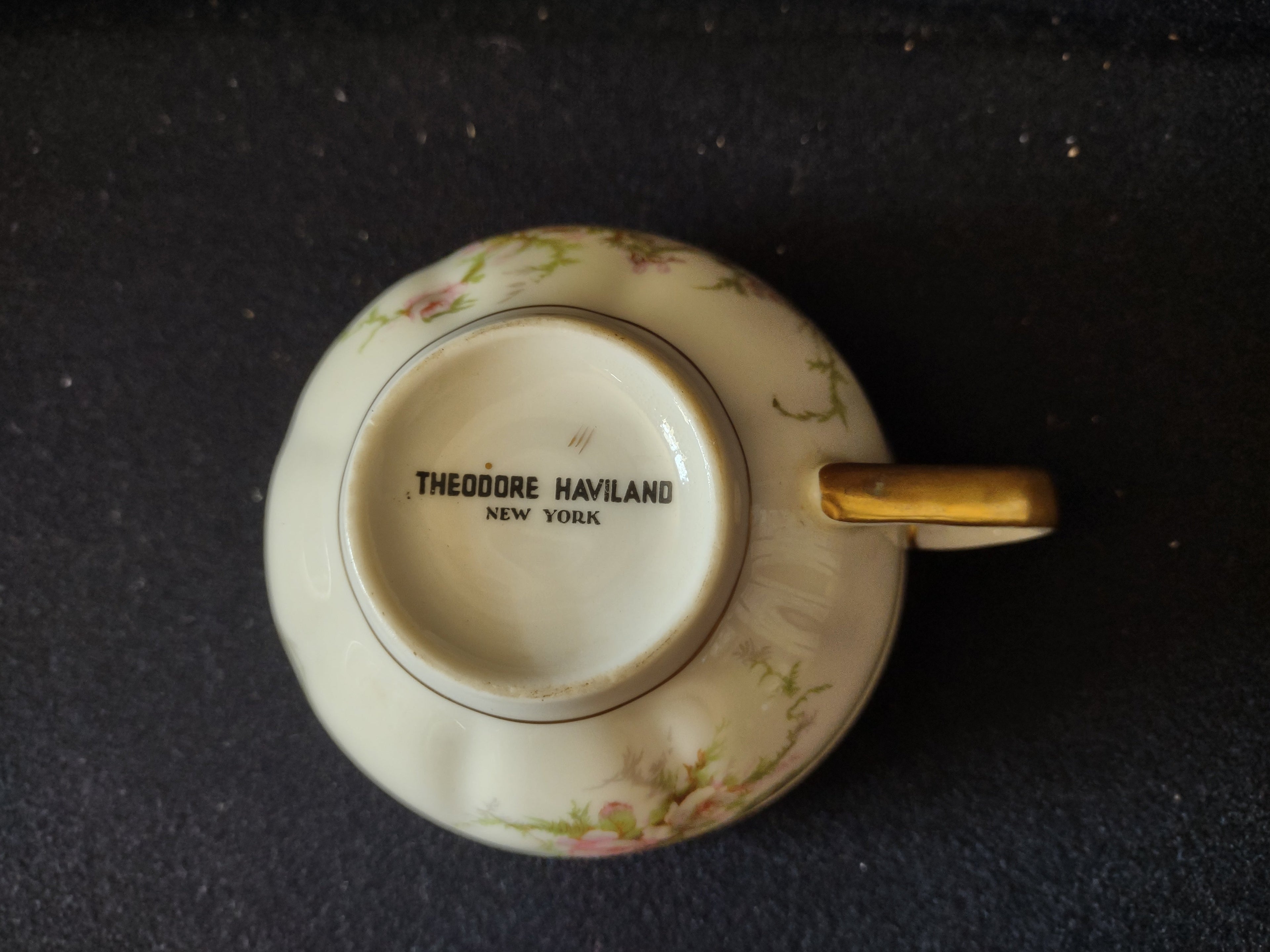 Theodore Haviland teacup base and handle detail with gold trim
