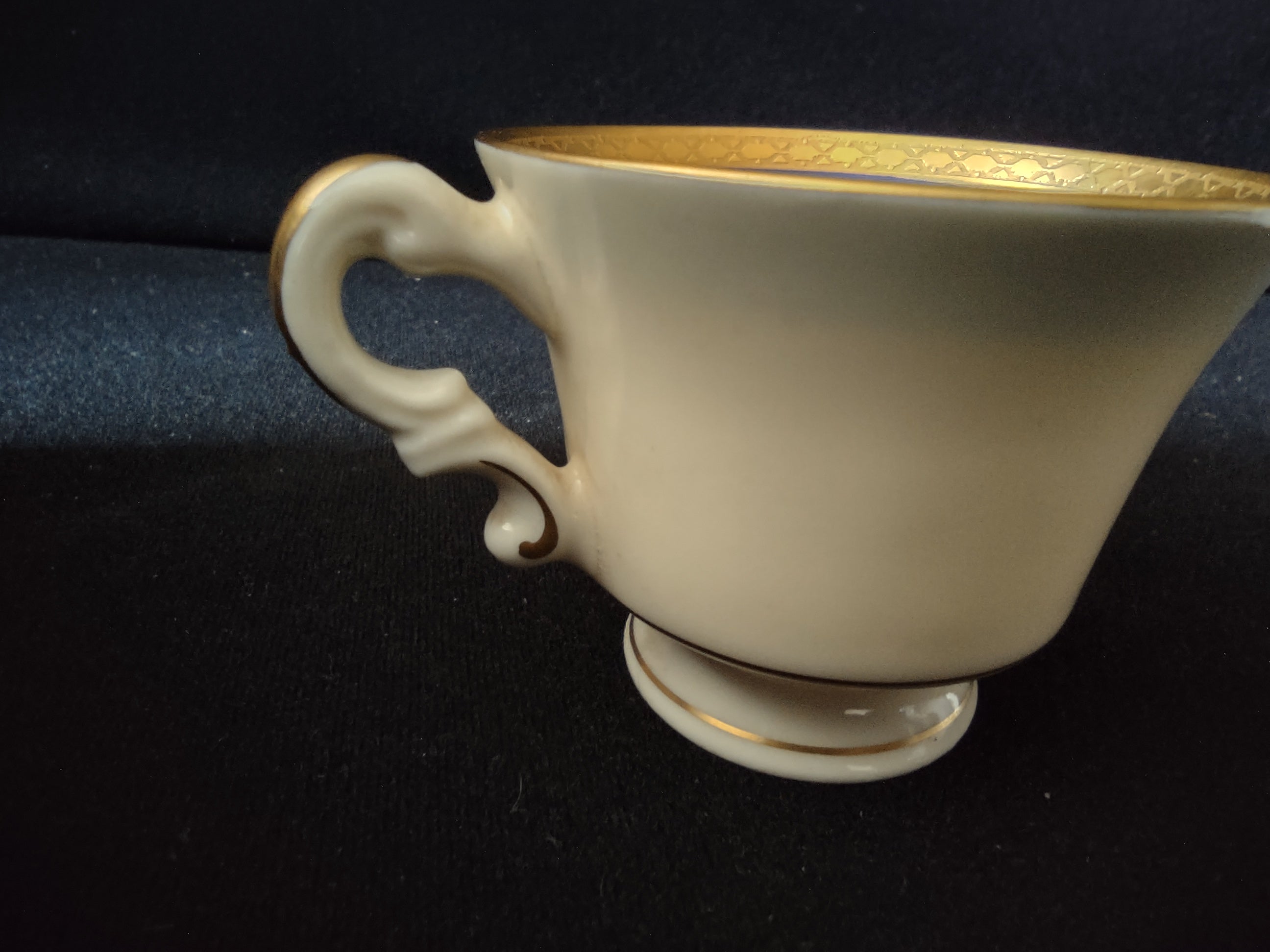 Syracuse China Old Ivory cup and saucer set overhead view