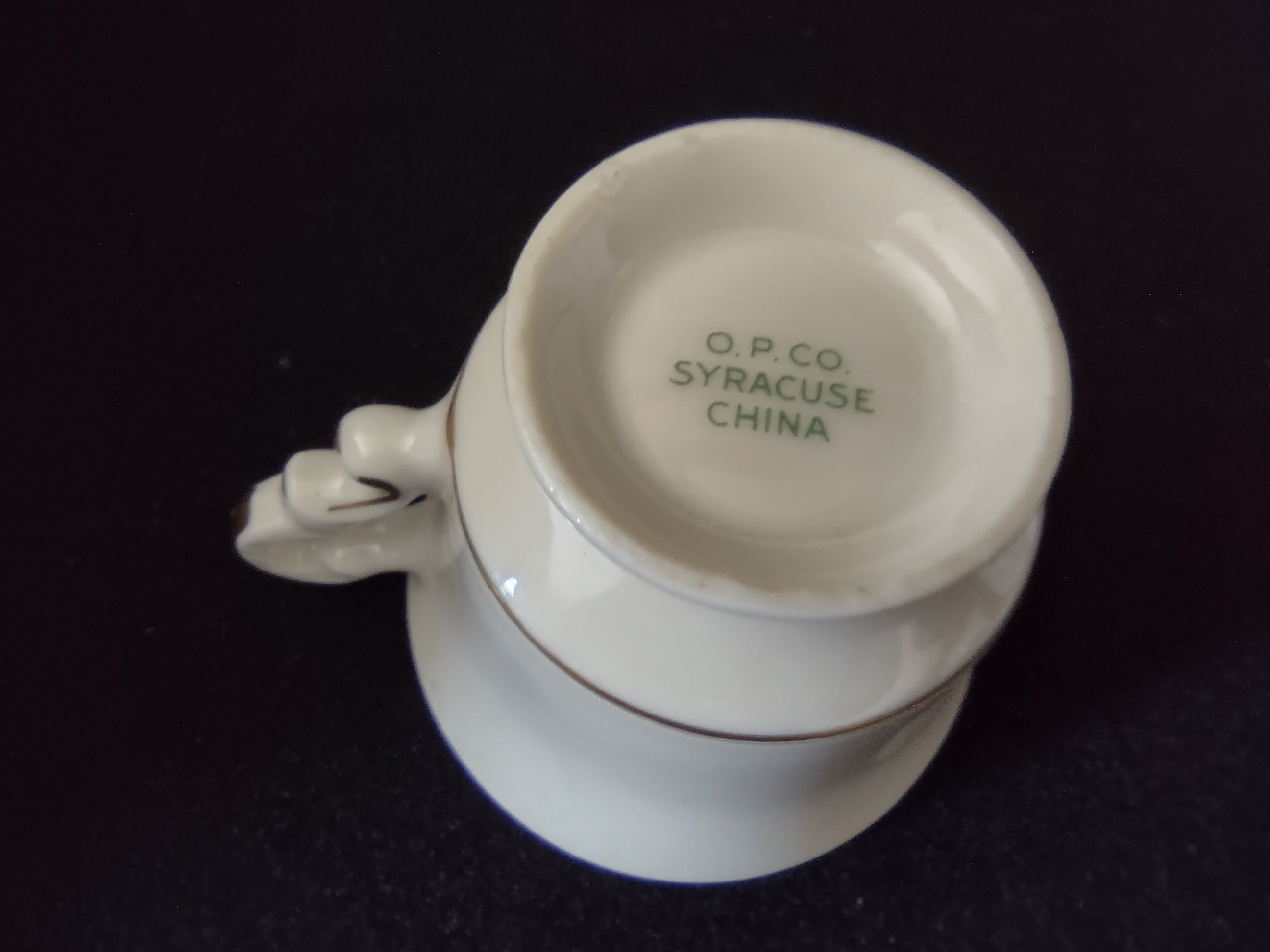 Syracuse China Old Ivory saucer full view showing gold and blue banded rim