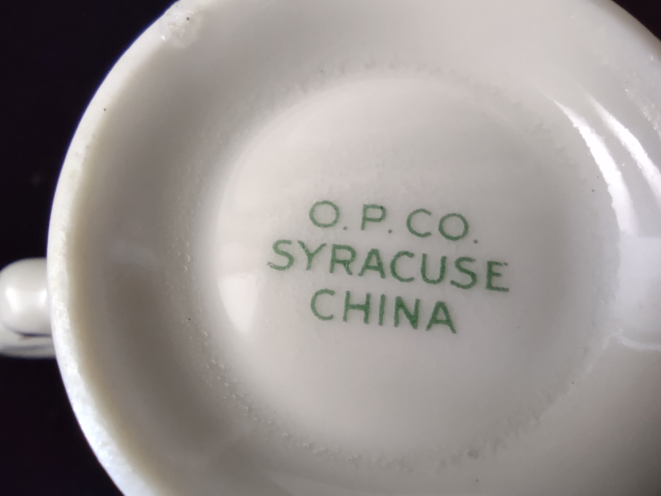 Syracuse China Old Ivory saucer showing gold encrusted band and cobalt blue stripe detail