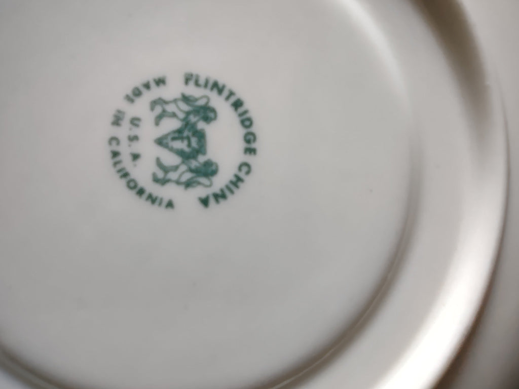 Flintridge China saucer with ruler showing approx 6 inch diameter
