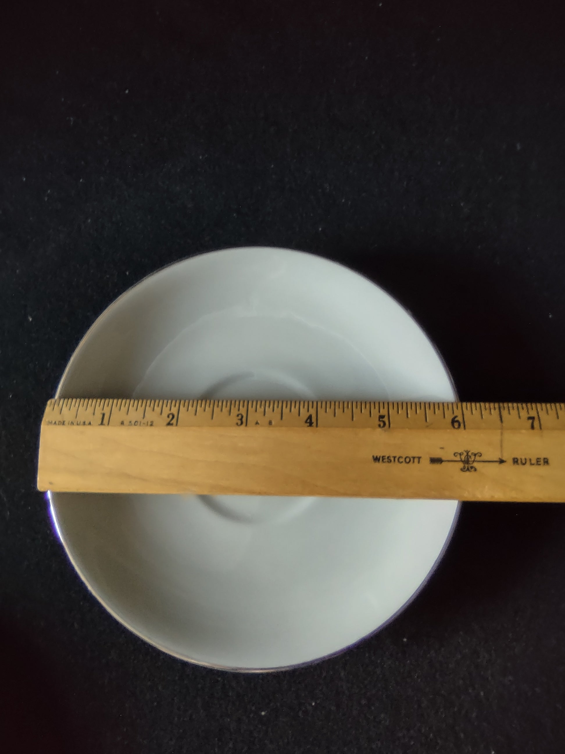 Flintridge China saucer interior close-up showing scratch