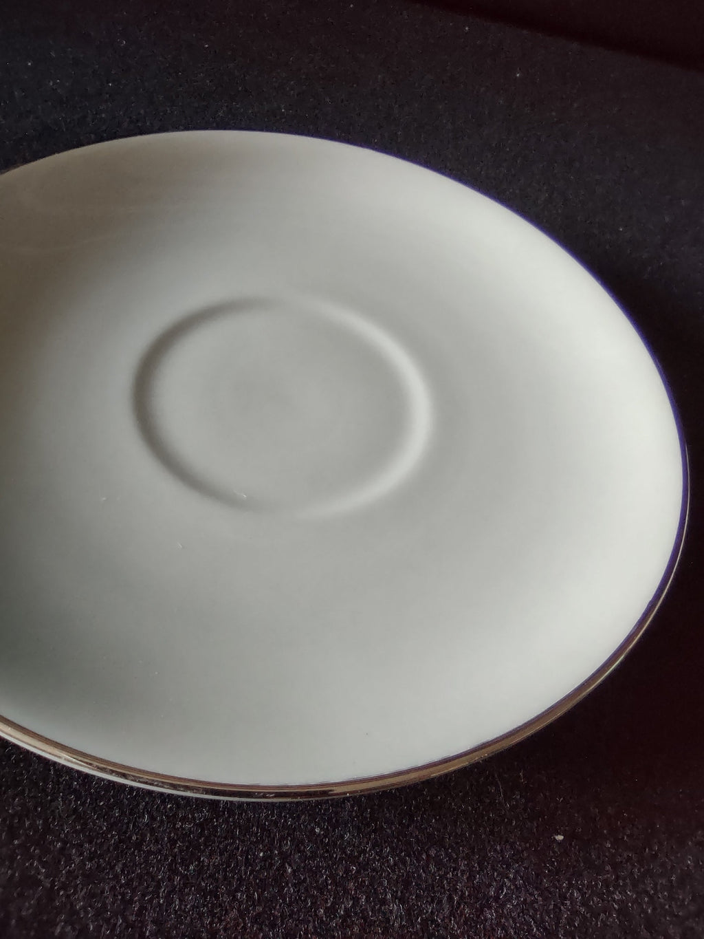 Flintridge China saucer with ruler showing approx 5.5 inch diameter