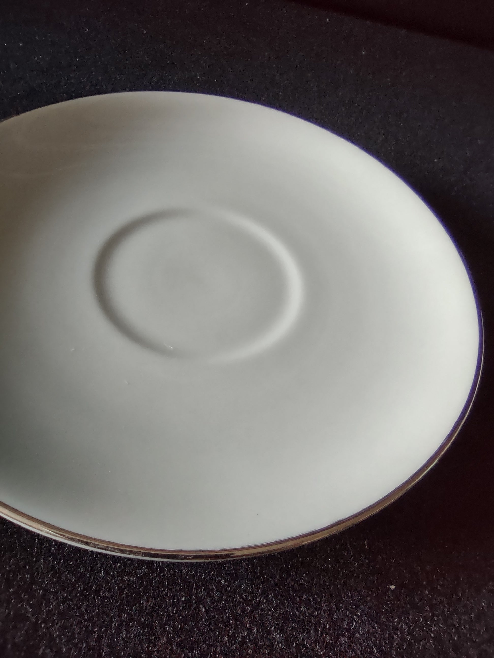Flintridge China saucer with ruler showing approx 5.5 inch diameter