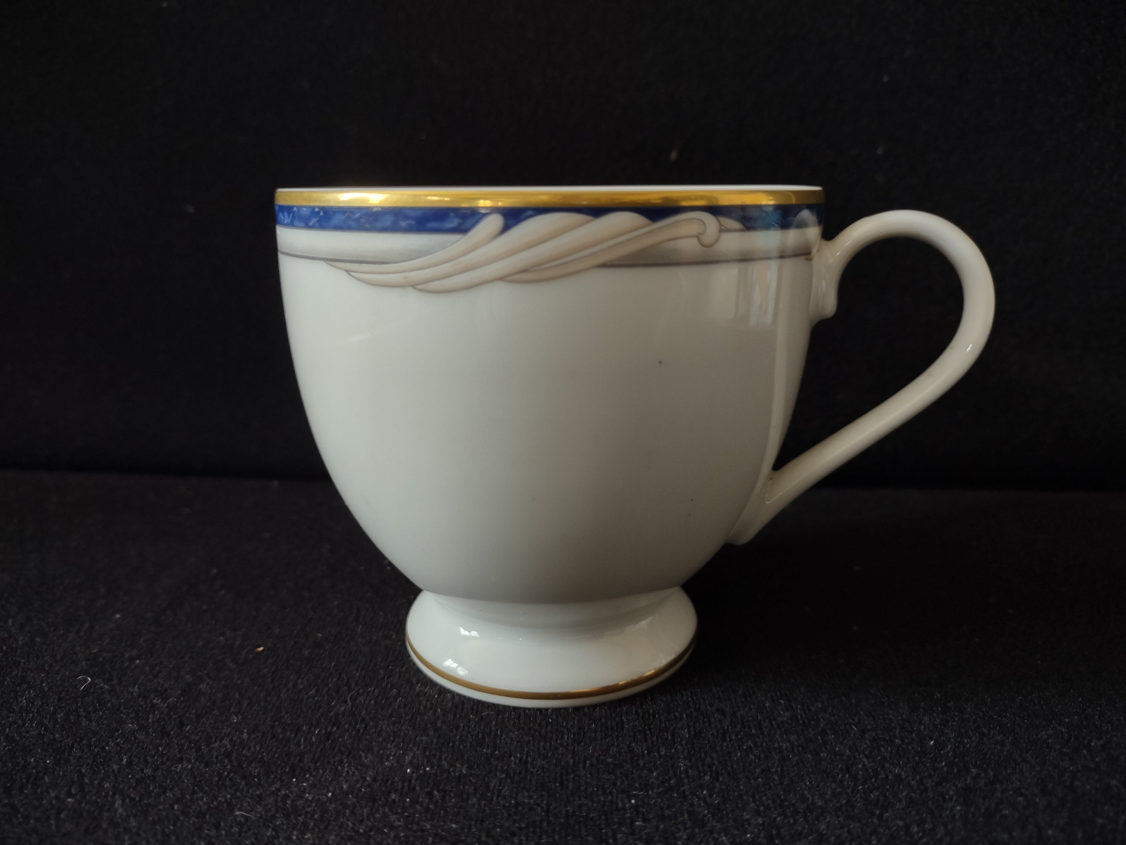 Gorham Golden Swirl Fine China teacup side view with blue band and gold trim