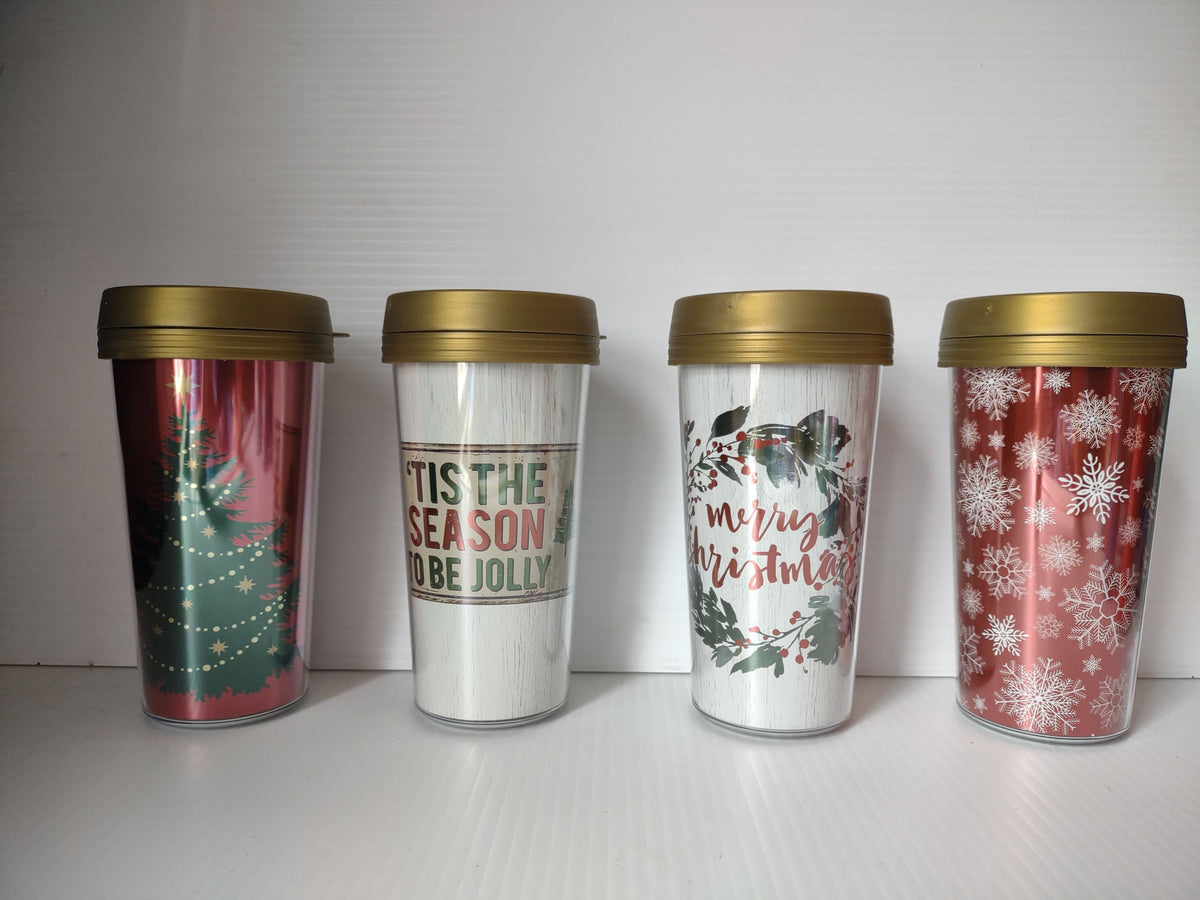 Set of 4 vintage Christmas acrylic tumblers with gold lids showing holiday designs